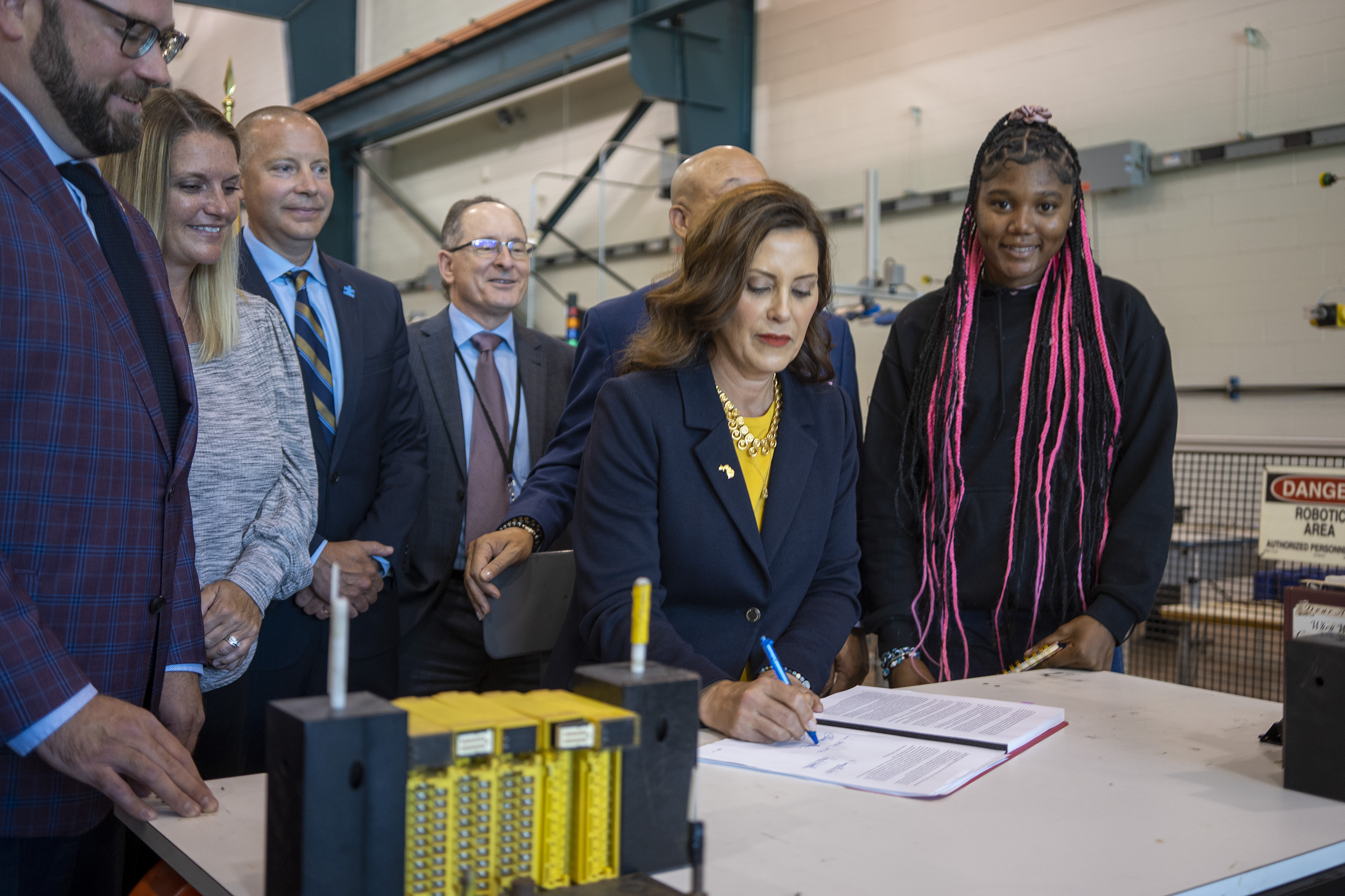 Gov. Gretchen Whitmer signs the state's education budget at Mott