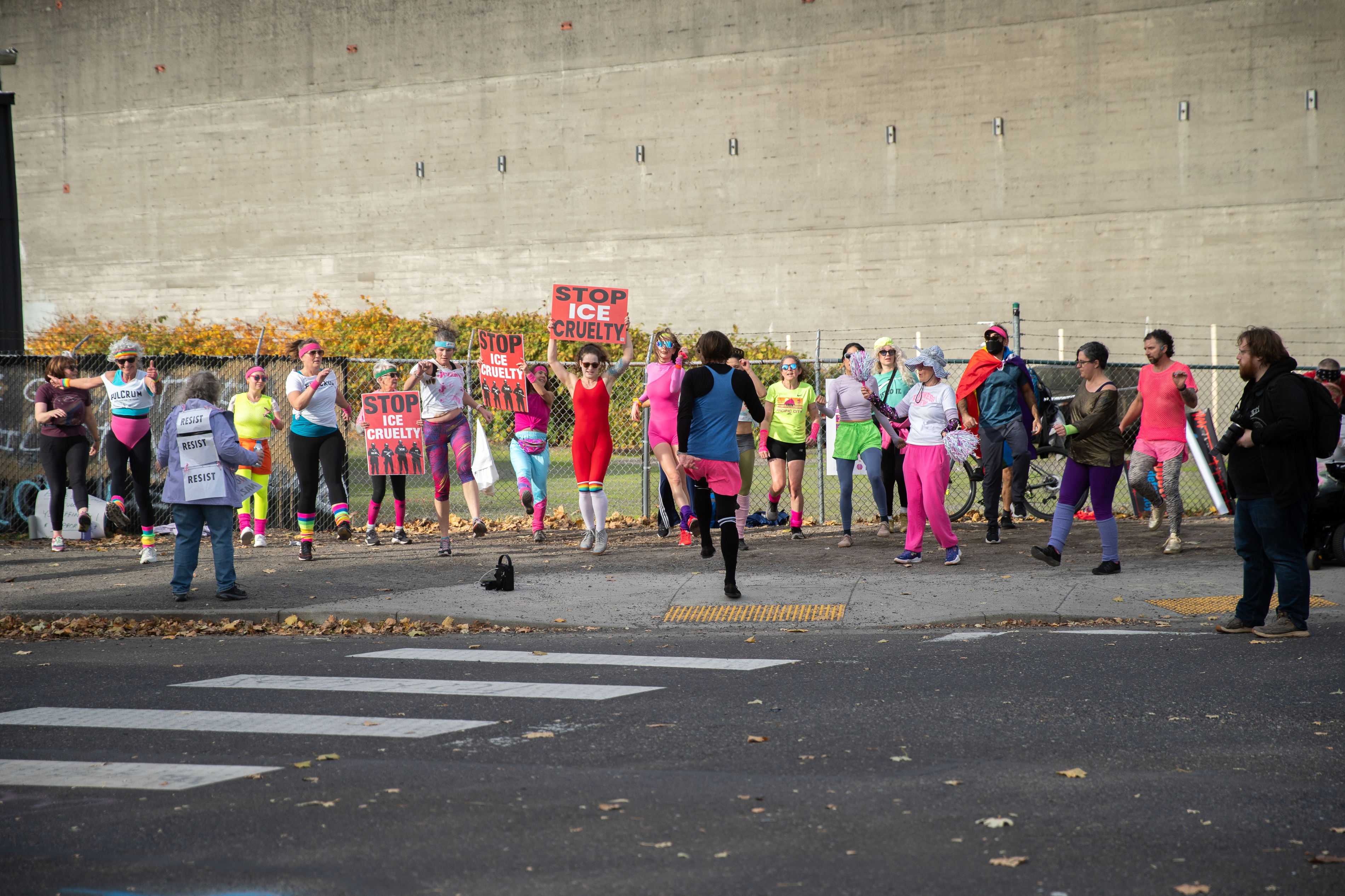 Participants in Fulcrum Fitness’s “Sweatin’ Out the Fascists” held an ’80s-aerobics peaceful protest outside the U.S. Immigration and Customs Enforcement (ICE) facility in South Portland on Sunday, Nov. 9, 2025, collecting donations for the Oregon Food Bank.