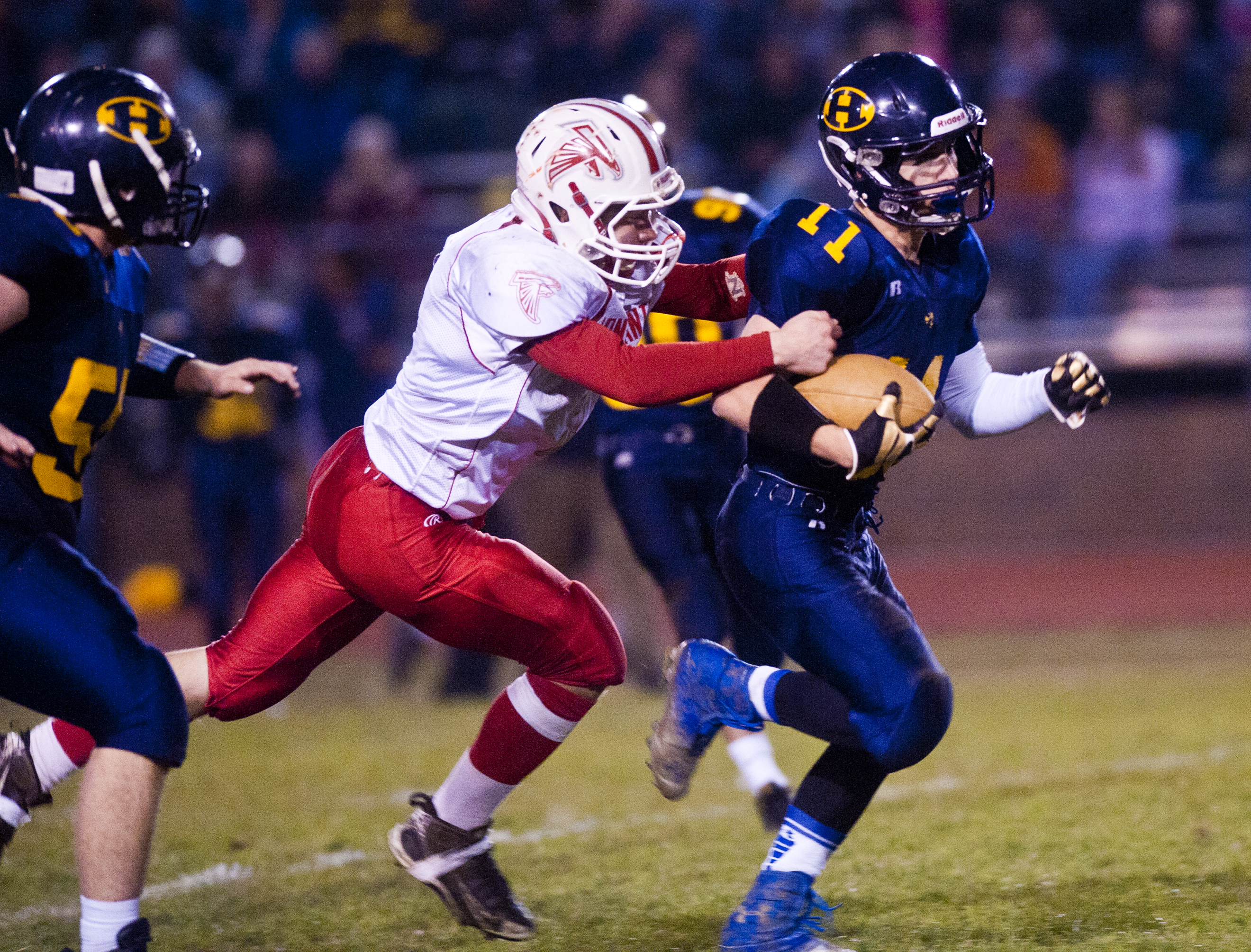 Floating helmets, dramatic skies and acrobatic grabs: Our favorite photos  from the 2016 high school football season