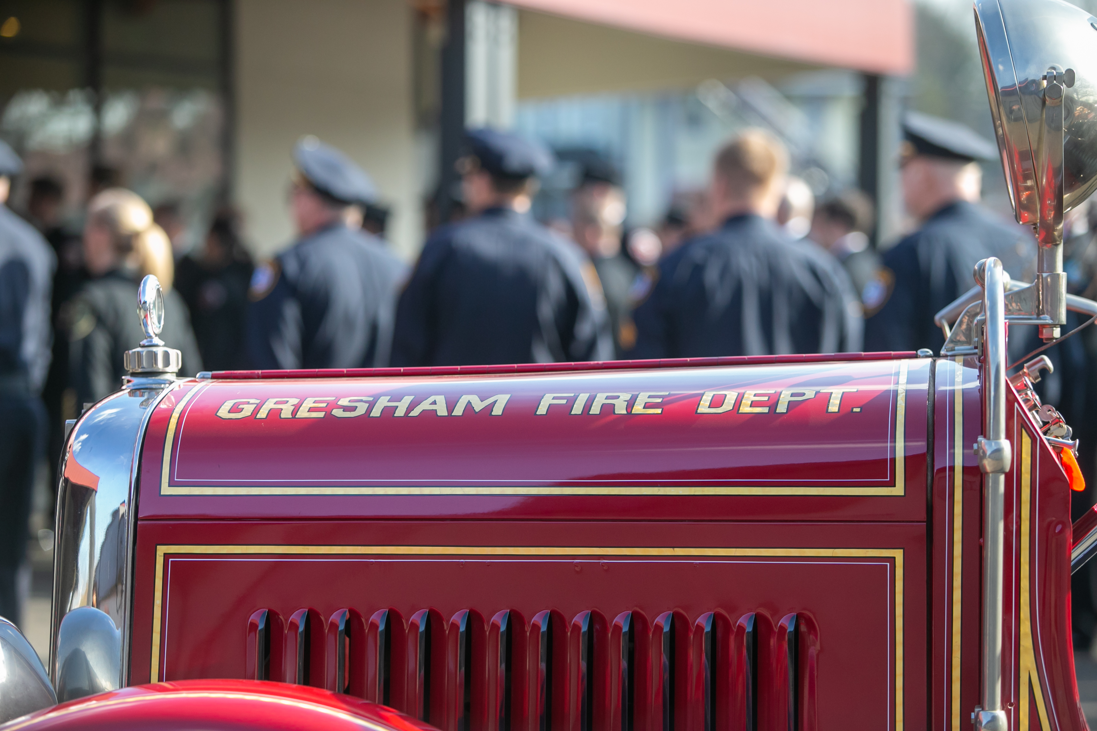 An old fire truck sits outside the memorial service honoring Gresham Firefighter Brandon Norbury in downtown Gresham, Oregon on Wednesday, Feb. 15 2023.
