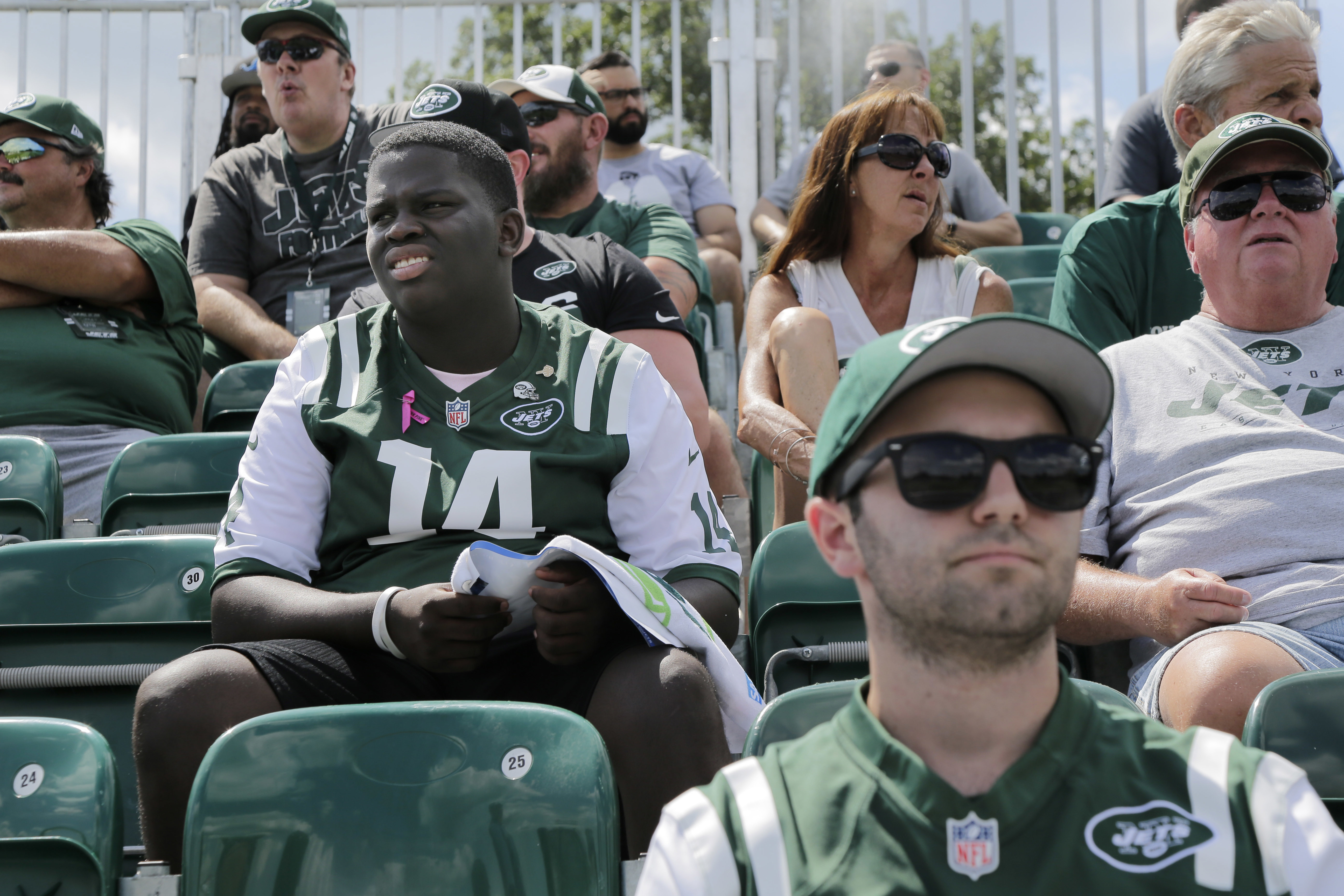 NY Jets fans participate in Jet Fest and watch their team practice