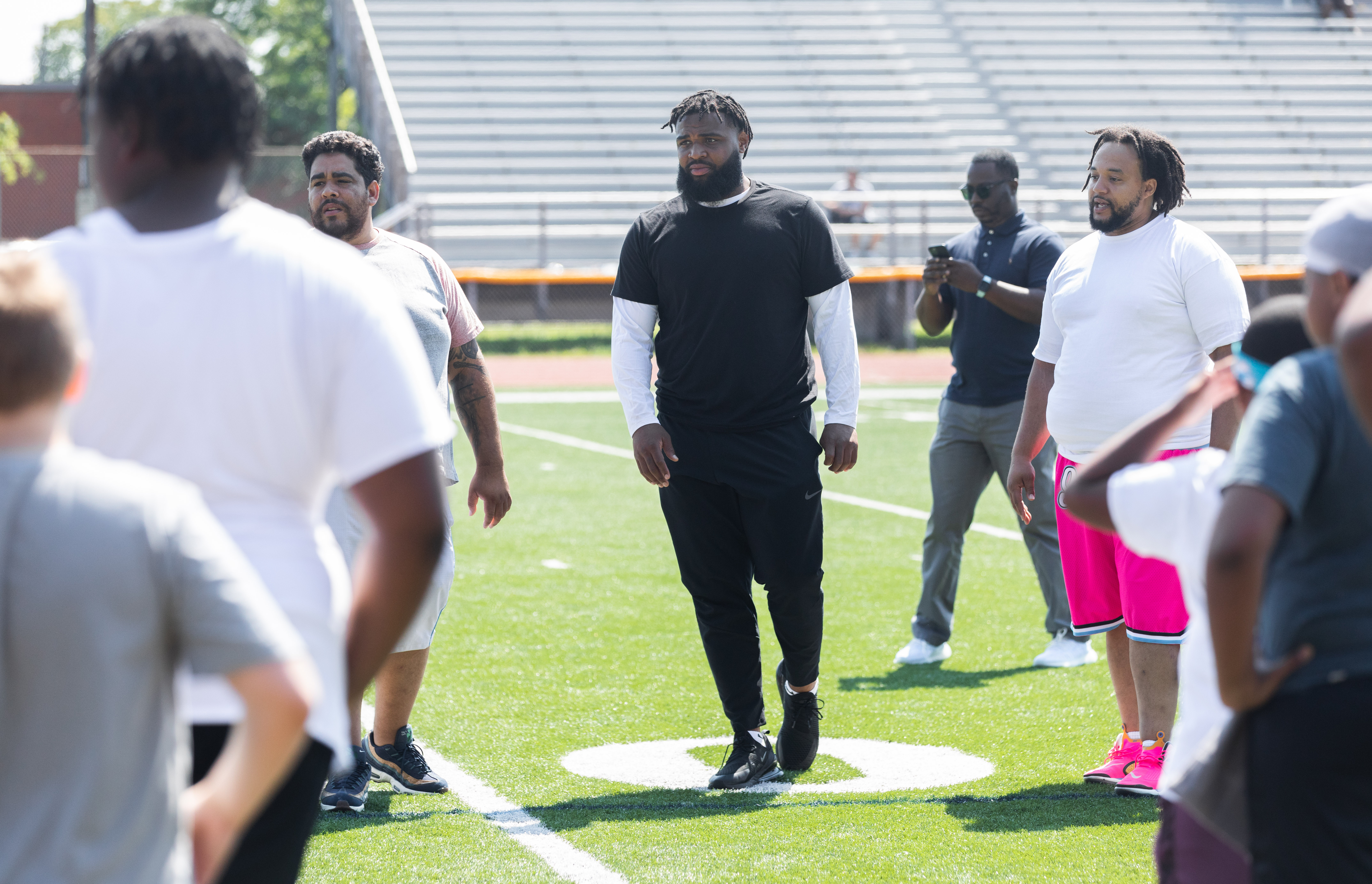 NFL stars return to Springfield for youth football camp