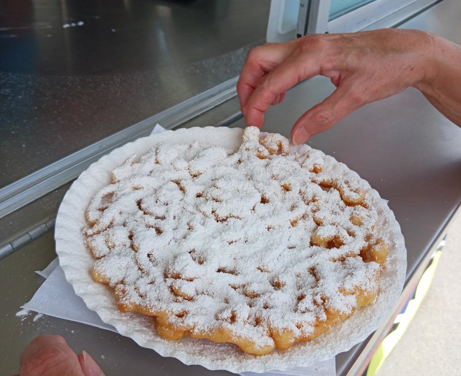 Regular funnel cake with confectioner's sugar from Reagan’s Sweet Shop.