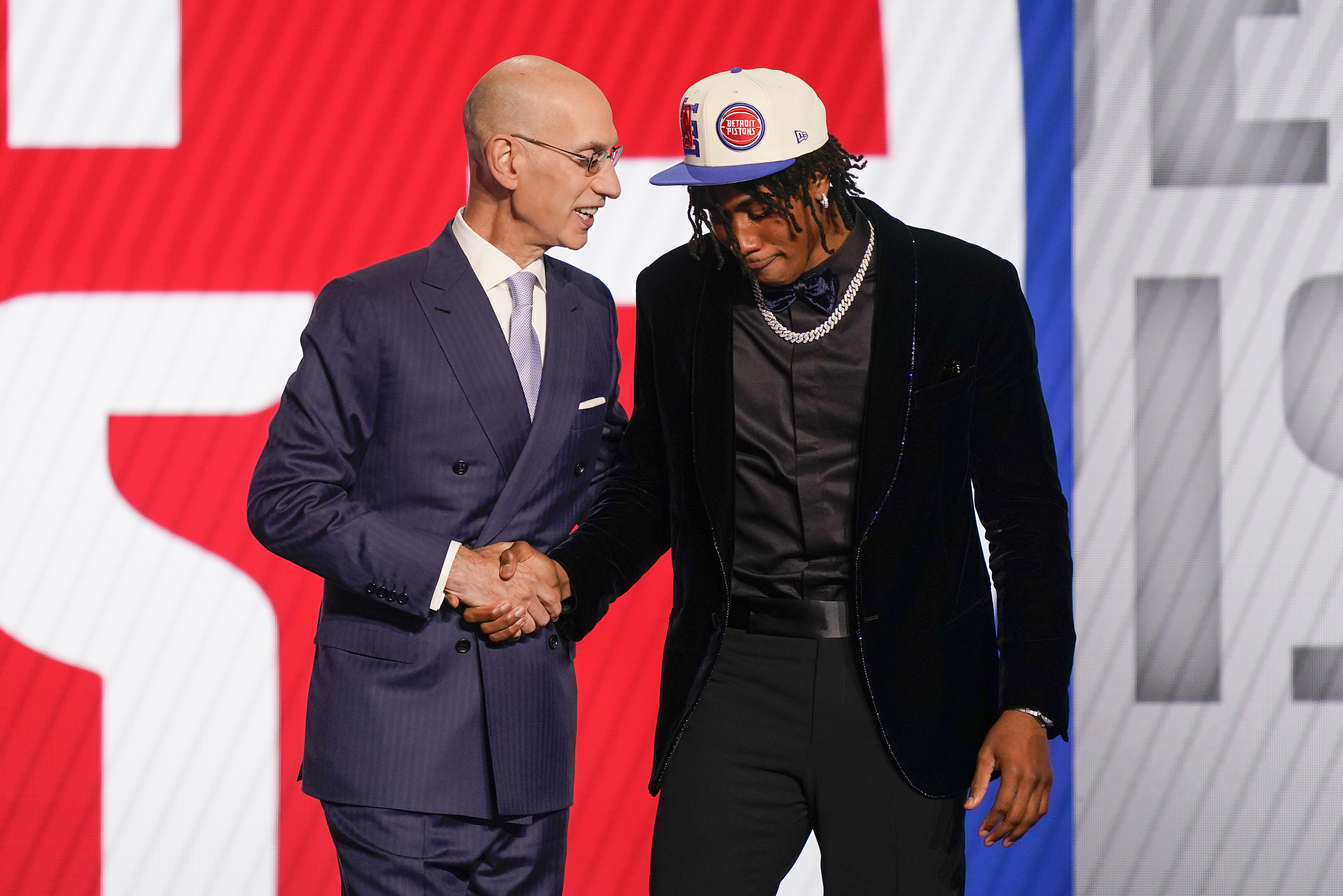 Detroit Pistons draft pick guard Jaden Ivey adjusts his cap before