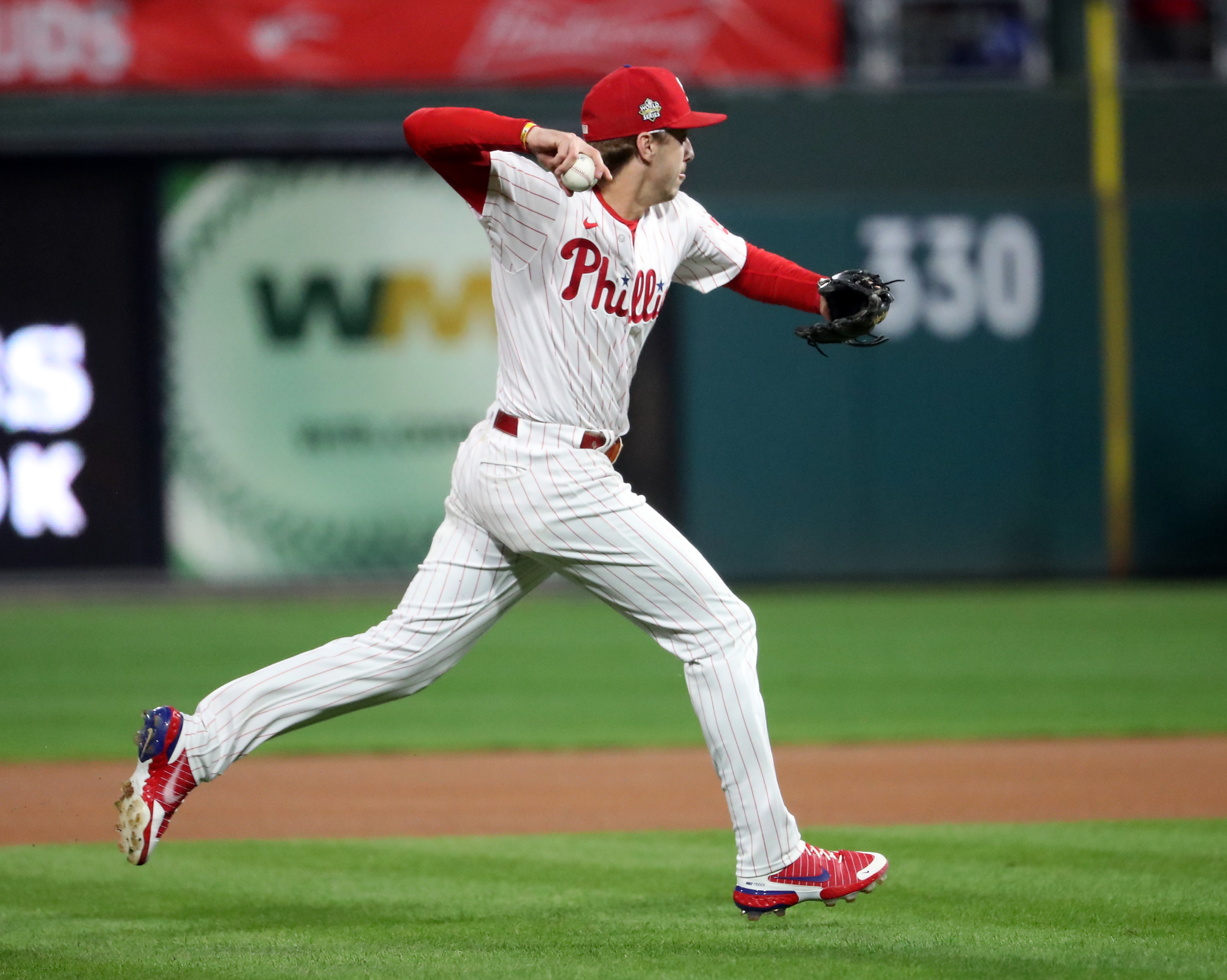 Bryson Stott (5) of the Philadelphia Phillies throws to first for the out in the first inning during World Series Game 3 against the Houston Astros at Citizens Bank Park, Tuesday, Nov. 1, 2022.