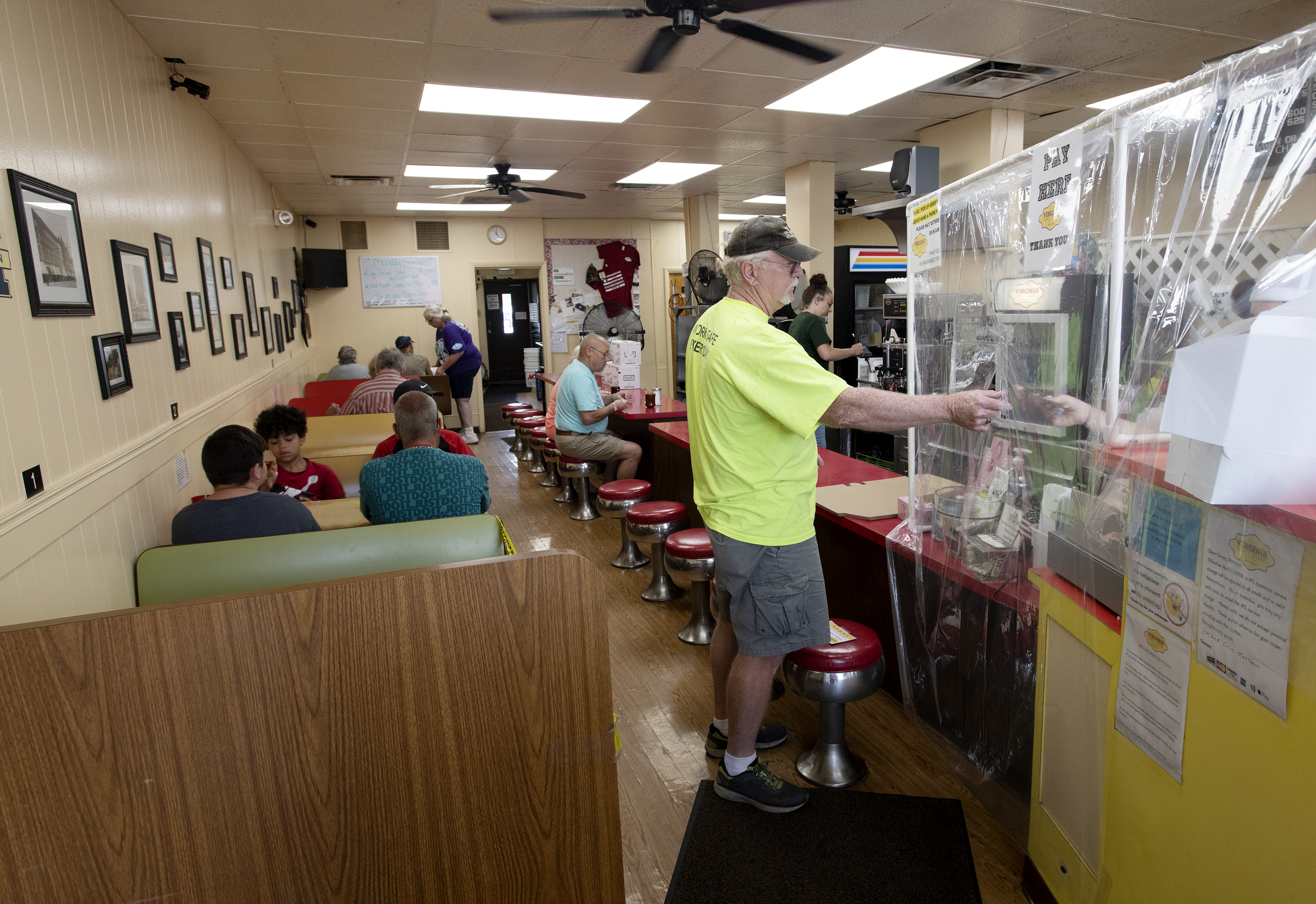 An order is paid for at Virginia Coney Island, 649 E. Michigan Ave., on Monday, July 6, 2020. The restaurant has been serving the Jackson community since 1914.