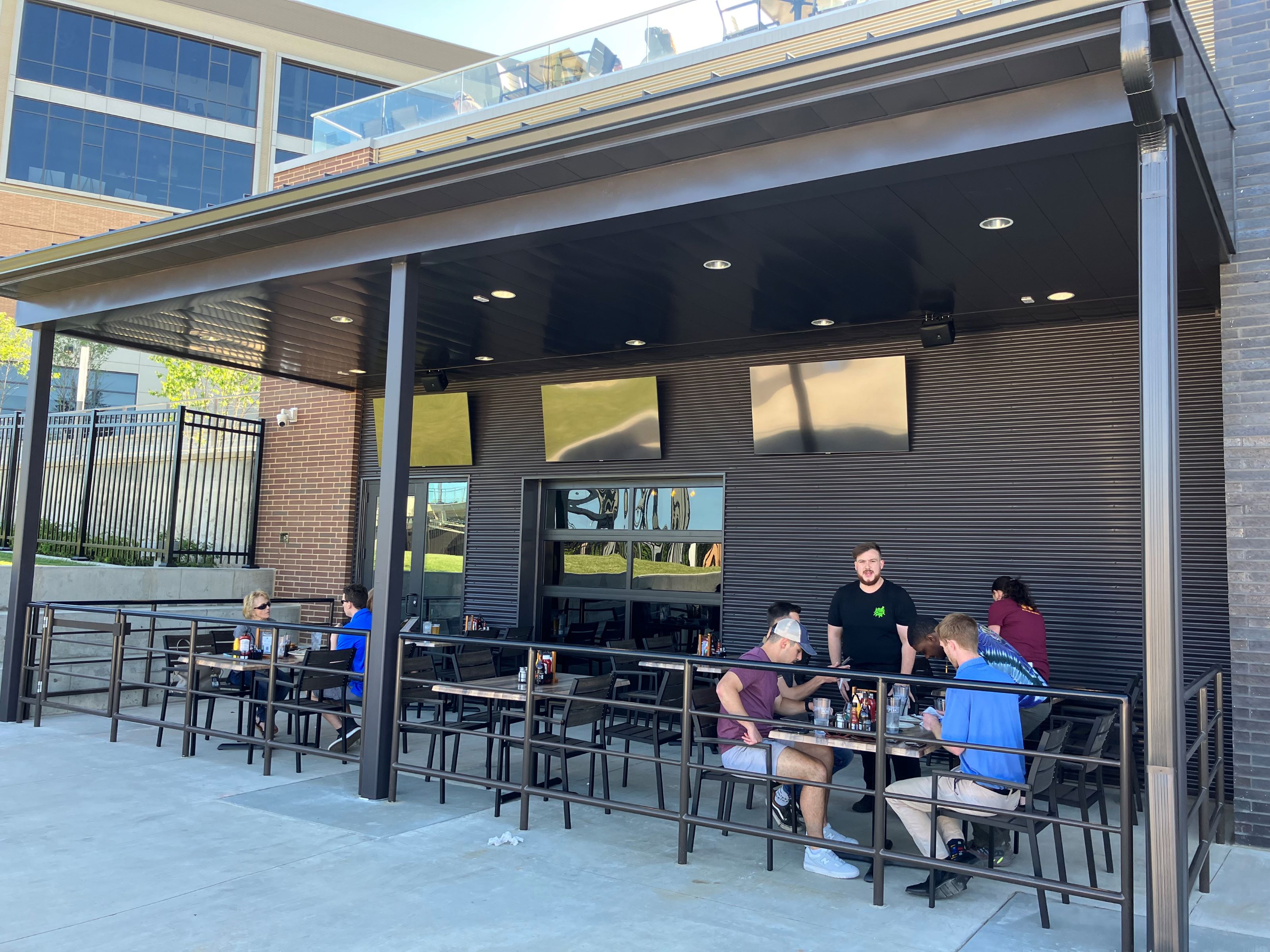 Brew Kettle with Topgolf simulators opens at Hall of Fame Village