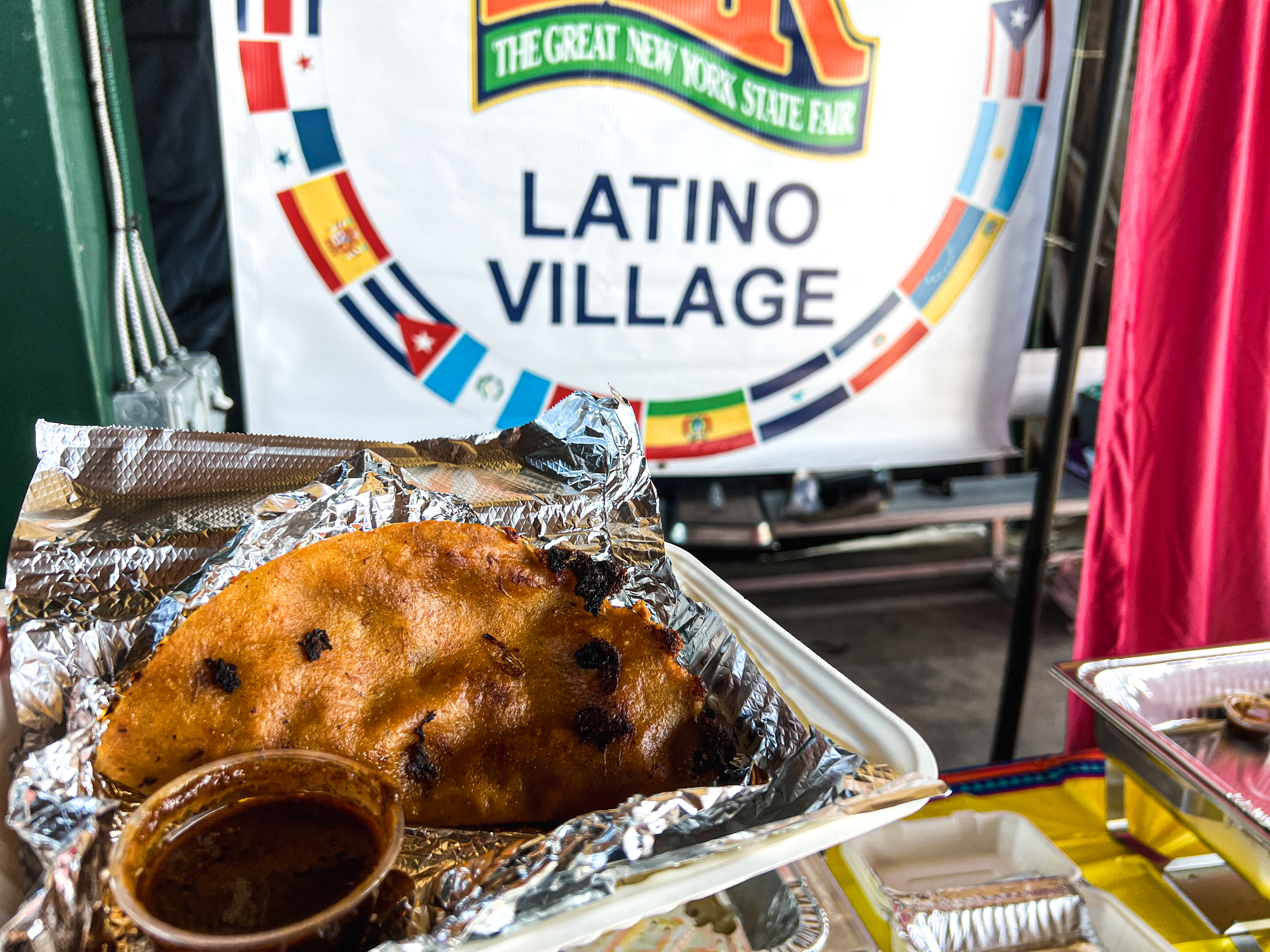 A taco an consumme from Birria Quesatacos SYR at the New York State Fair. (Charlie Miller | cmiller@syracuse.com)