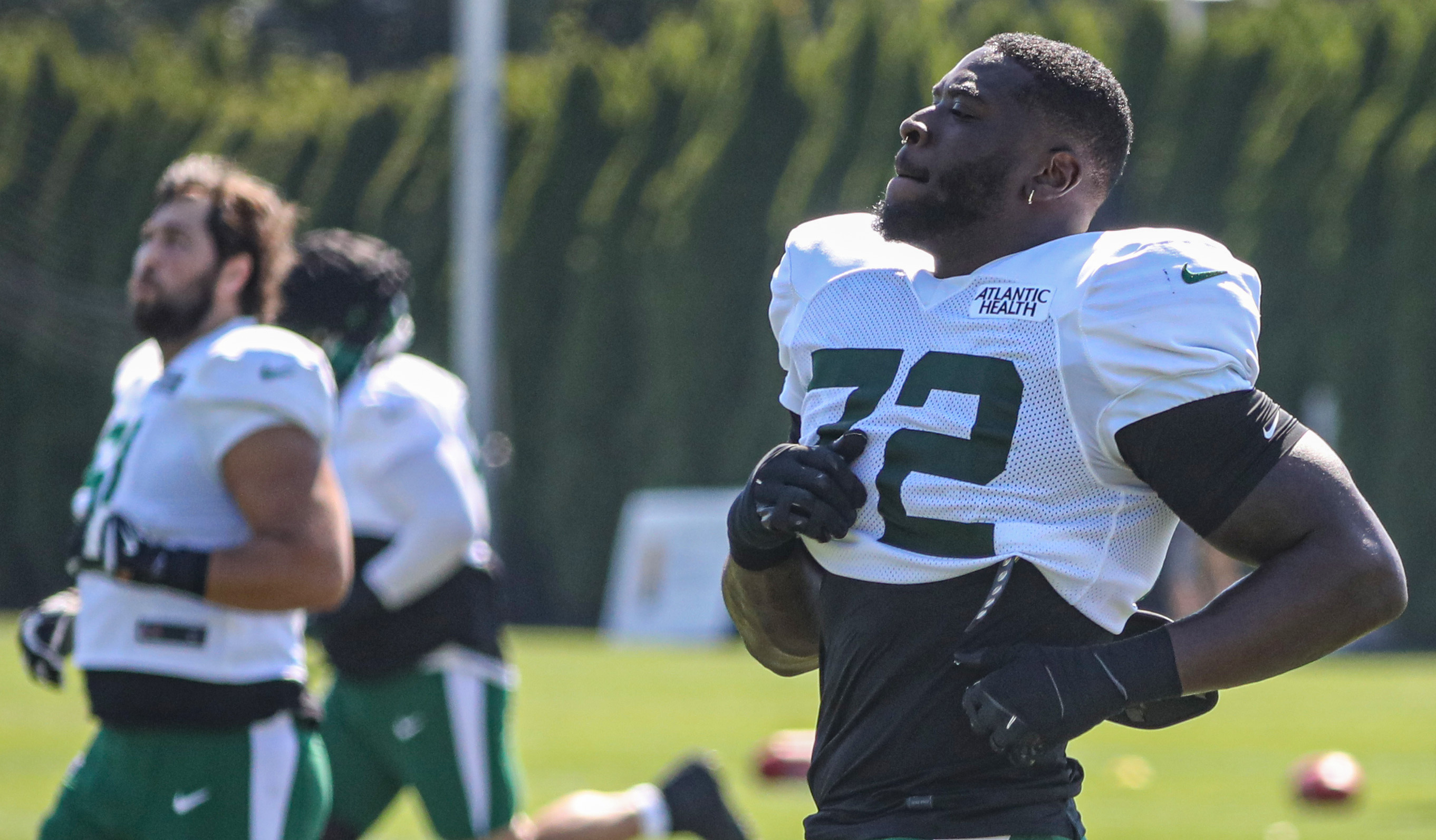 New York Jets defensive end Micheal Clemons (72) runs against the