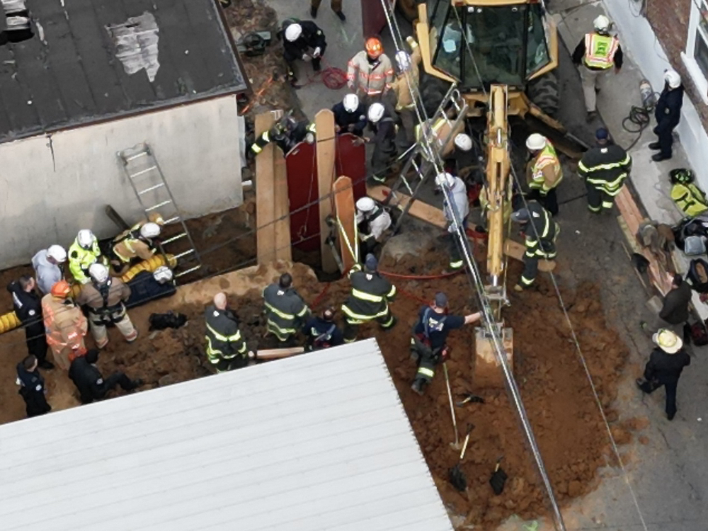 Worker rescued from trench collapse after 8 hours as temperatures ...