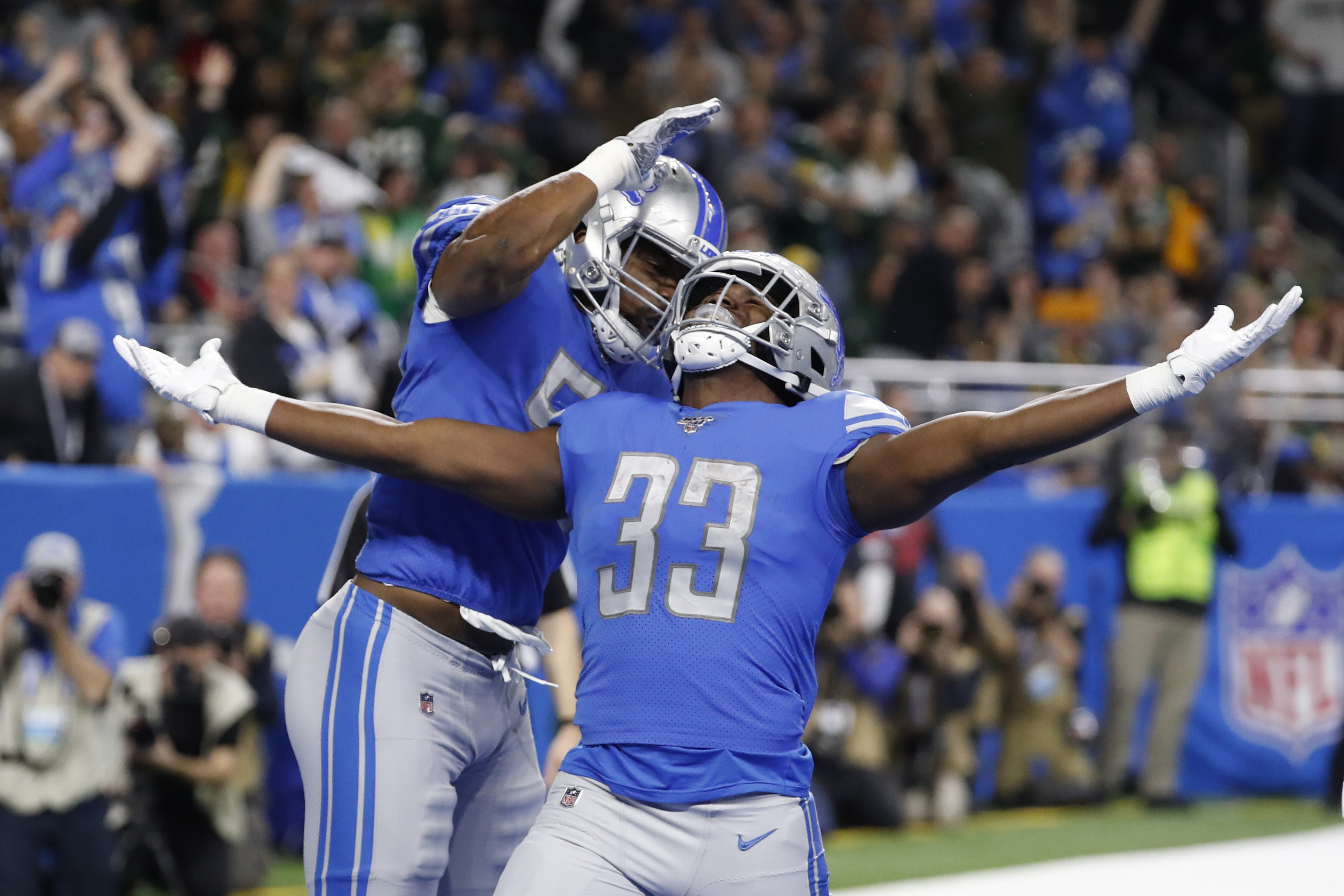 Jason Cabinda of the Detroit Lions runs the ball against the New