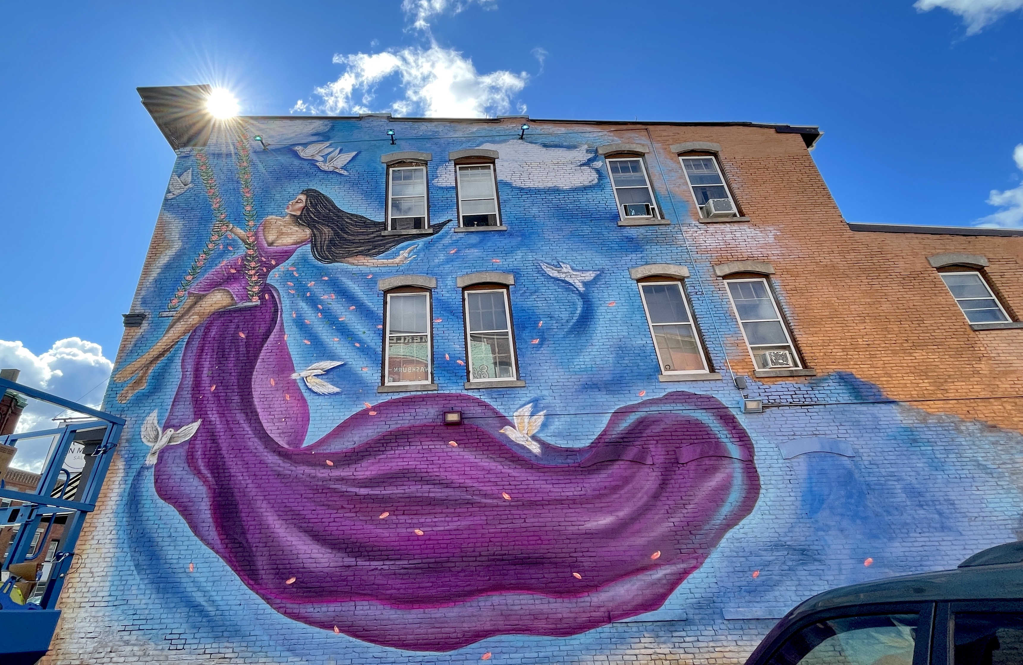 Artist Jacqueline Colello paints three-story mural for Francesca's