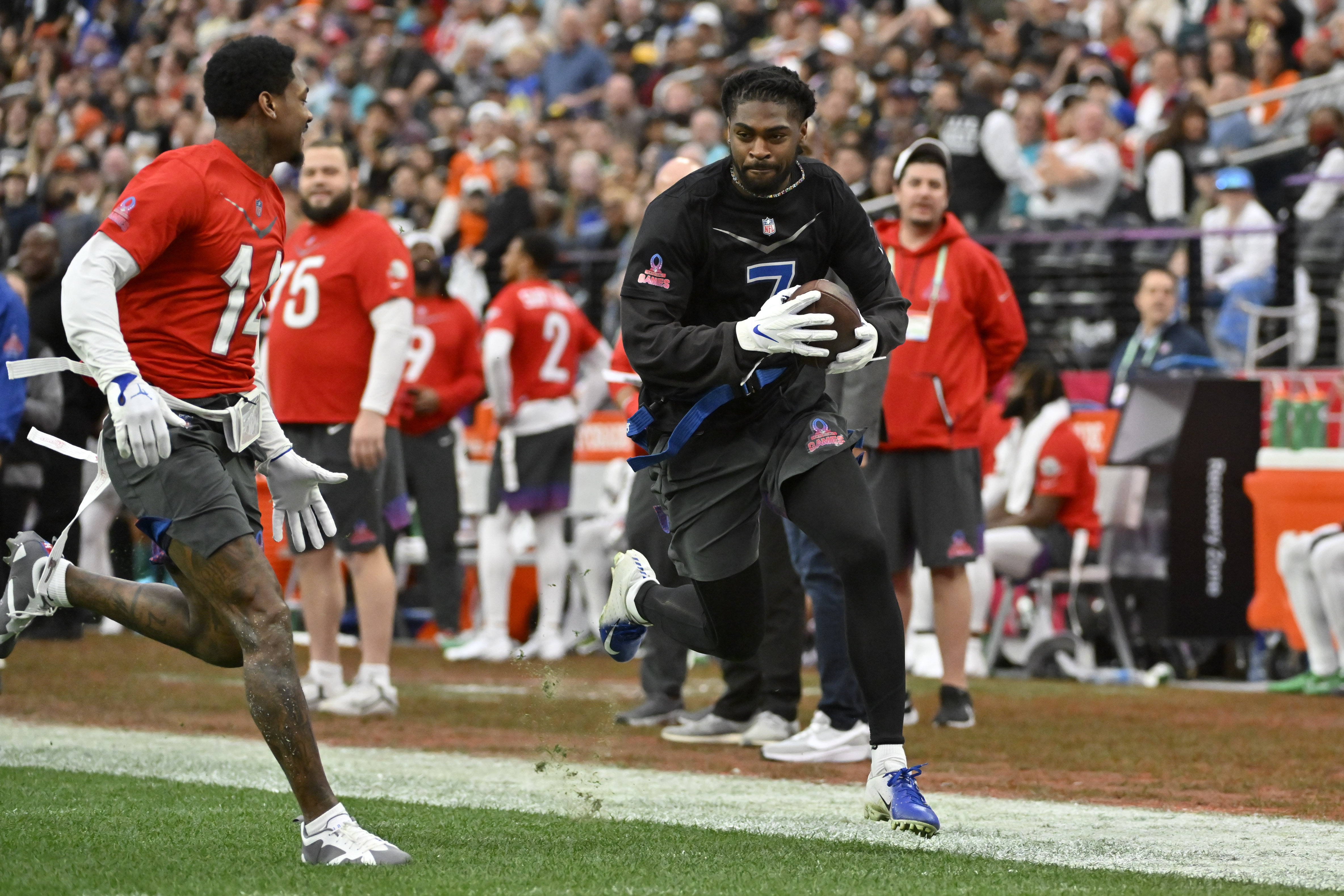 NFC tight end George Kittle (85) of the San Francisco 49ers celebrates a  touchdown with NFC wide receiver Justin Jefferson of the Minnesota Vikings  during the flag football event at the NFL