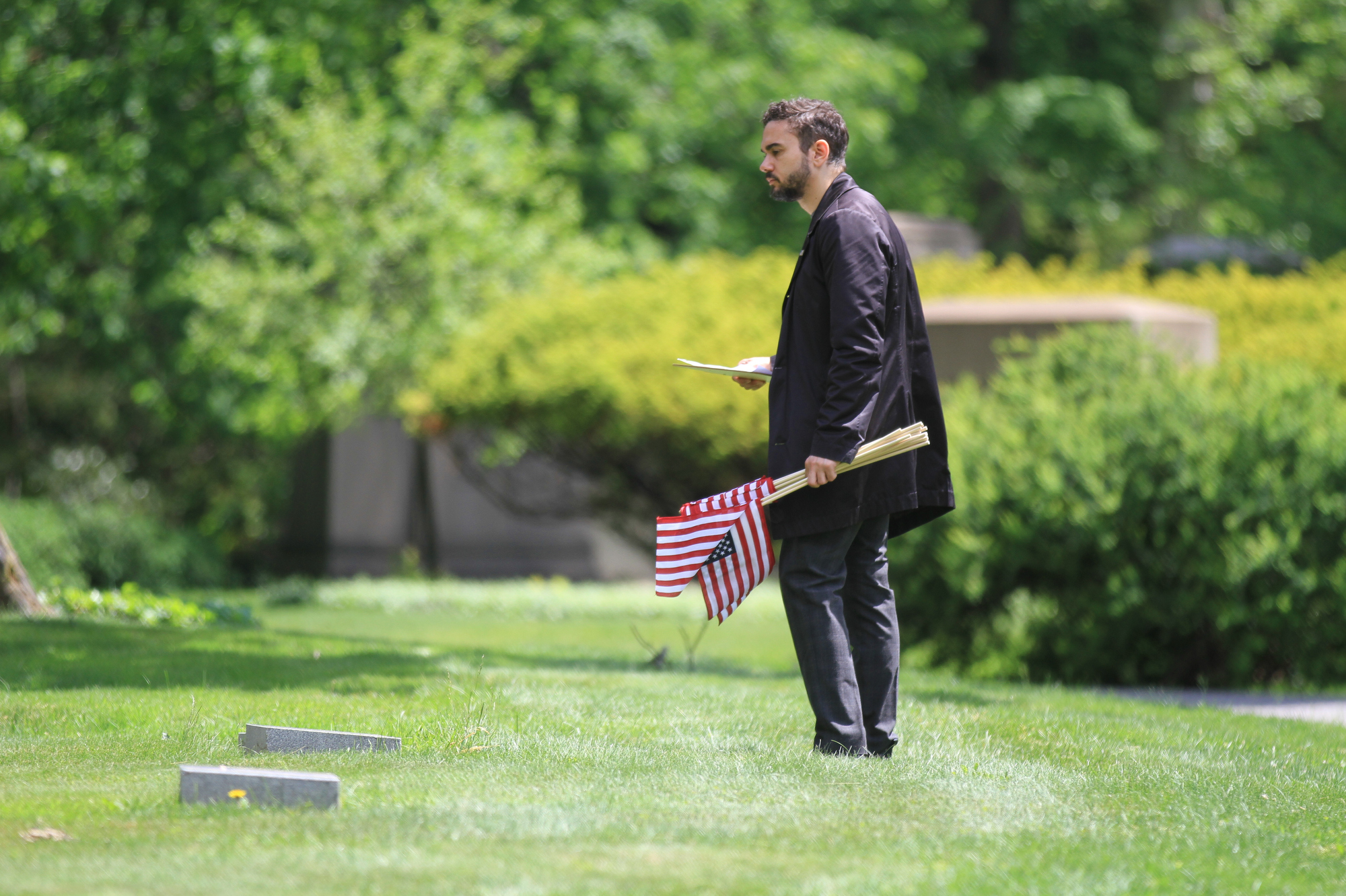 Flags placed on gravesites at Lake View Cemetery for Memorial Day ...