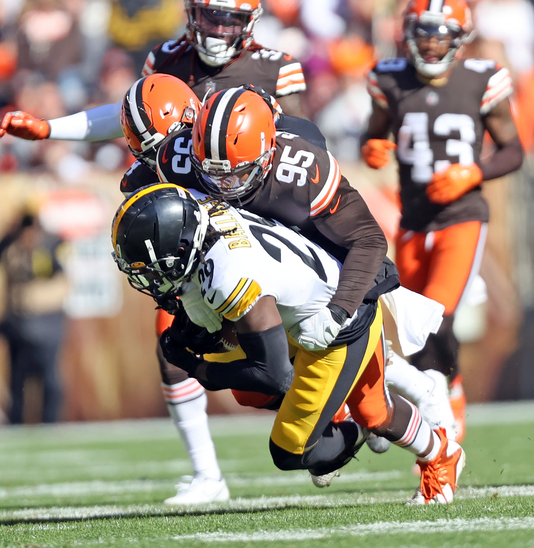 Cleveland Browns defensive end Myles Garrett (95) tackles Pittsburgh  Steelers running back Kalen Ballage (29) during