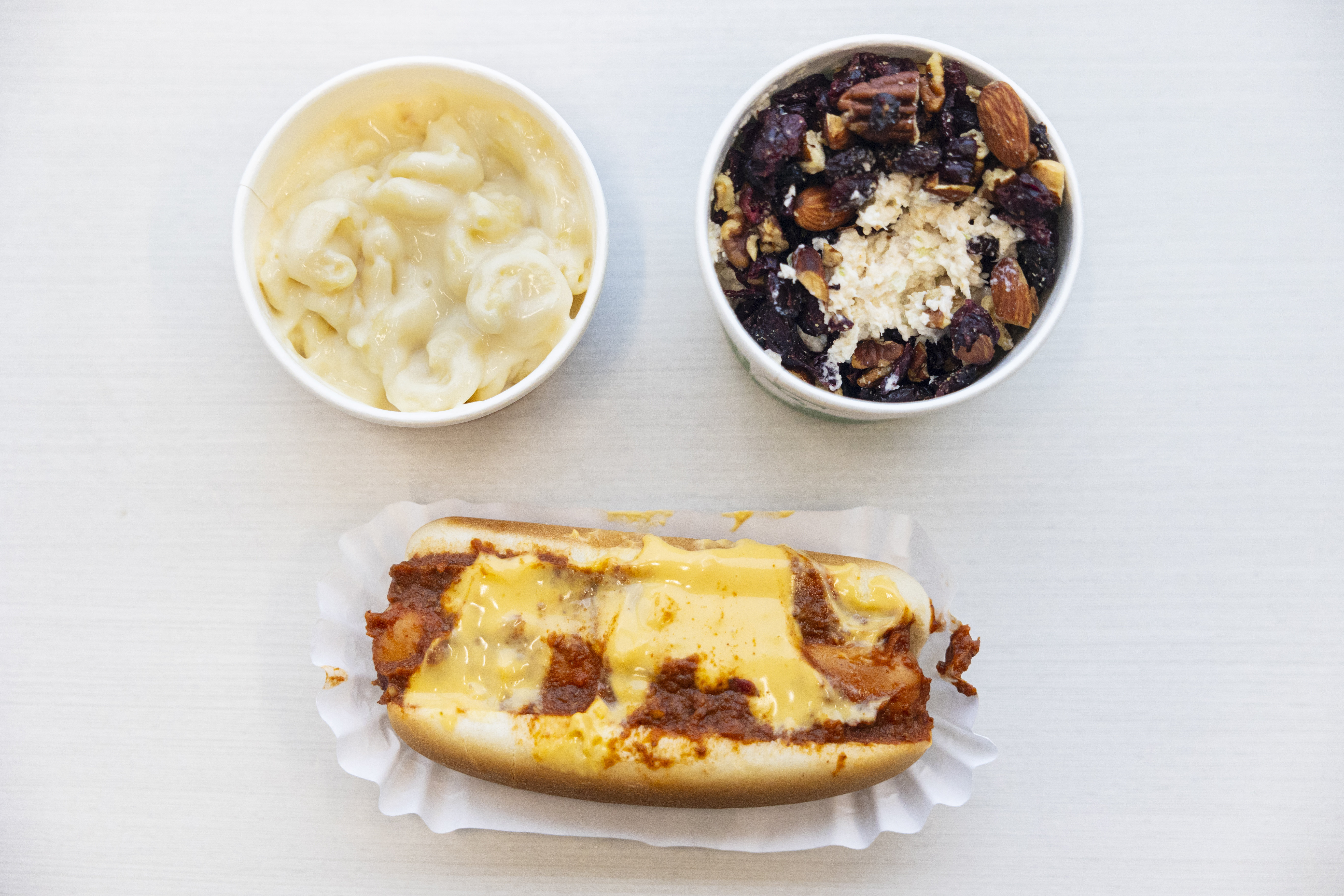 (Left to right cw) Mac and cheese, “bowl of wonder”, chicken cherry salad and a chili cheese dog from Totally Brewed Cafe in downtown Kalamazoo, Michigan on Wednesday, Jan. 3, 2024. 