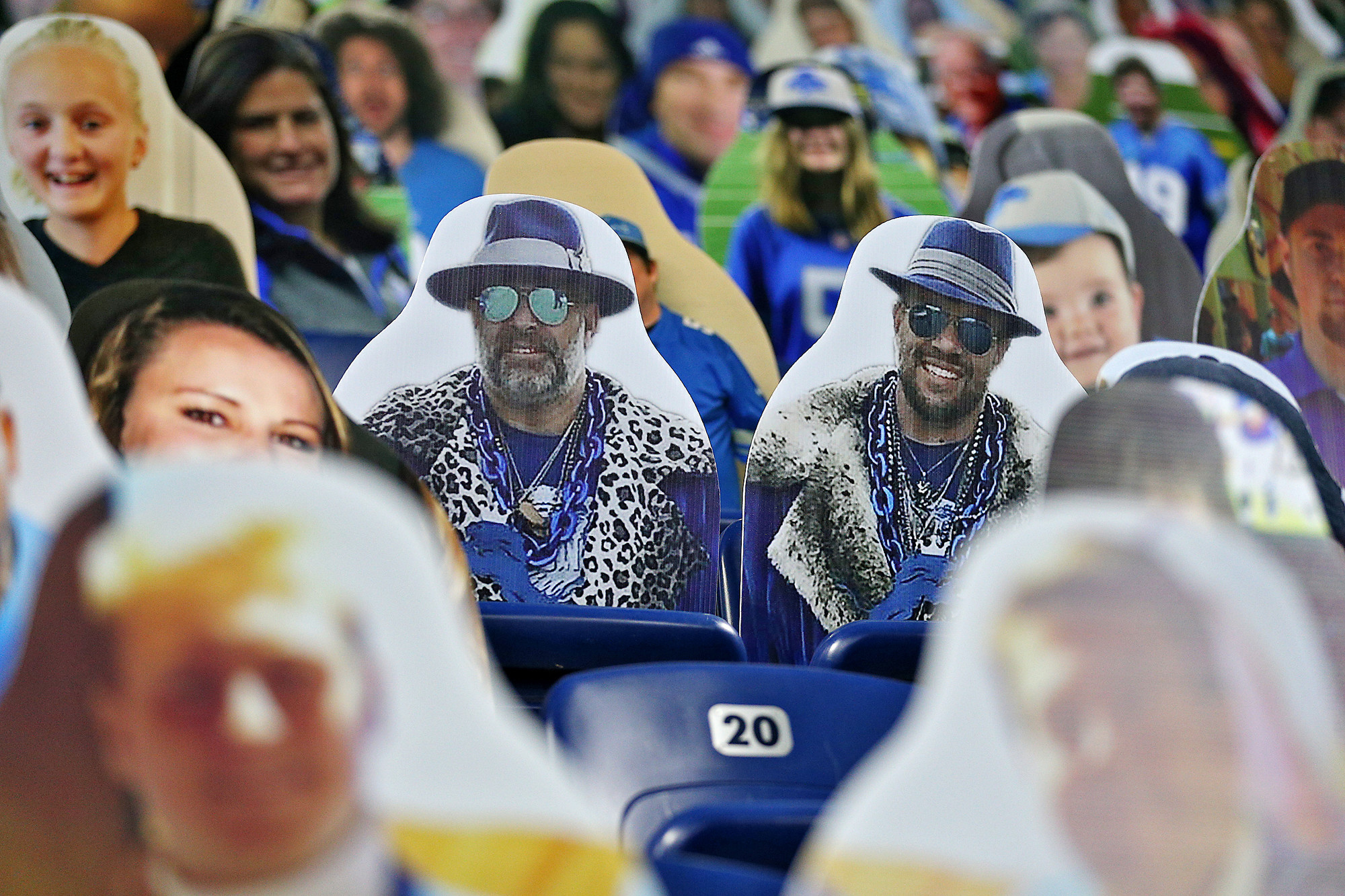 A Detroit Lions fan wears a bag during the fourth quarter of an NFL  football game against the Chicago Bears at Ford Field in Detroit, Sunday,  Dec. 5, 2010. (AP Photo/Carlos Osorio