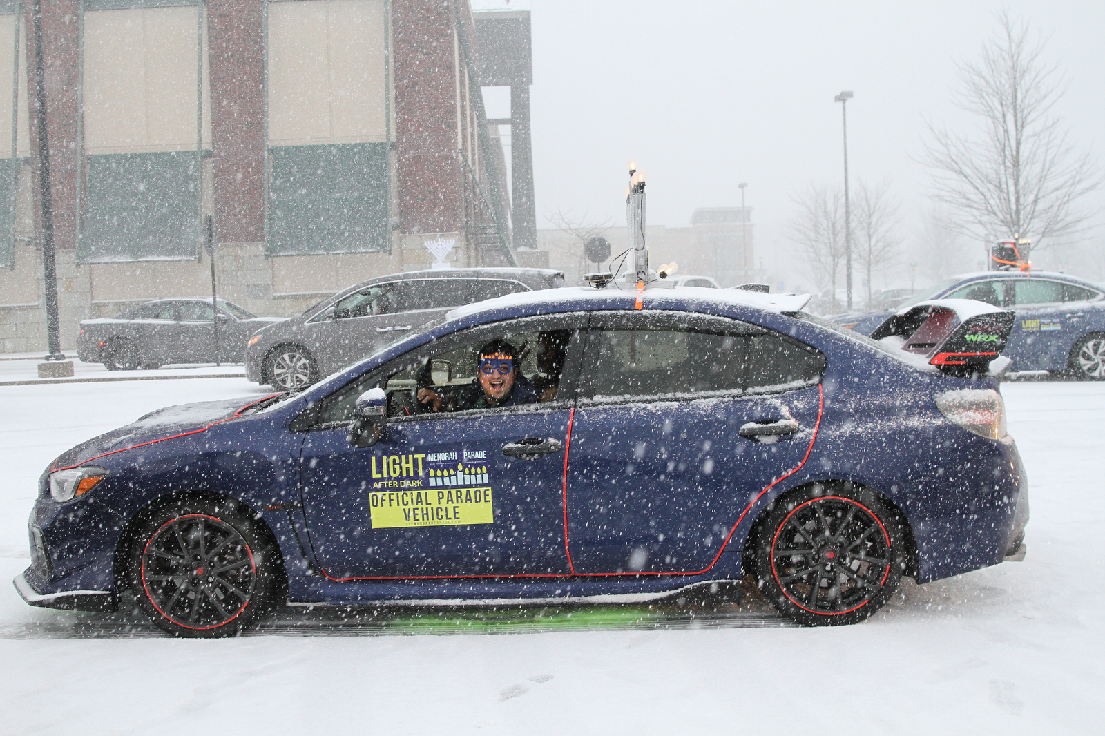 Menorahtopped cars parade through Cleveland eastern suburbs