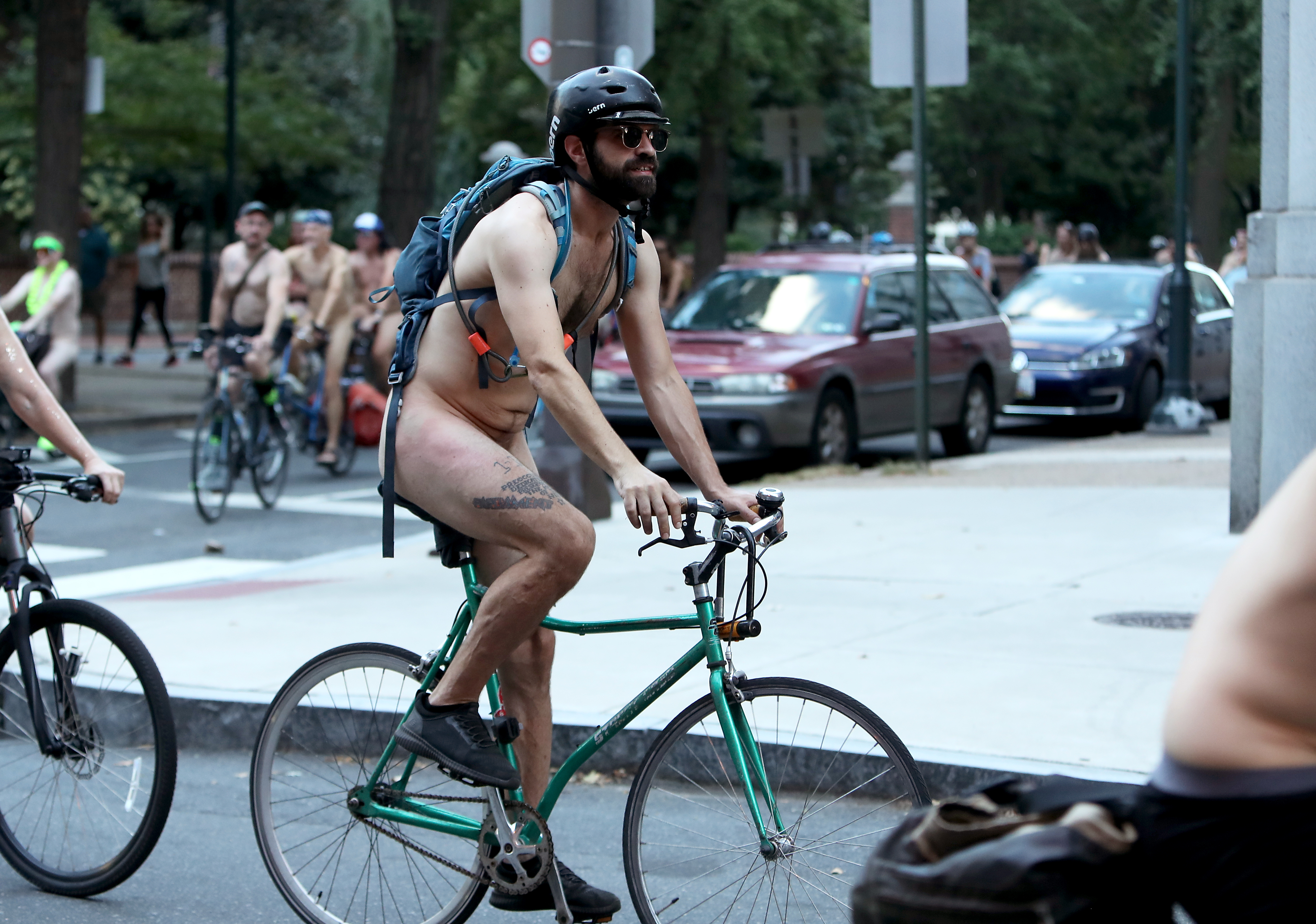 People ride bikes around Washington Square onto Walnut Street in Philadelphia during the Philly Naked Bike Ride, Saturday, Aug. 27, 2022.
