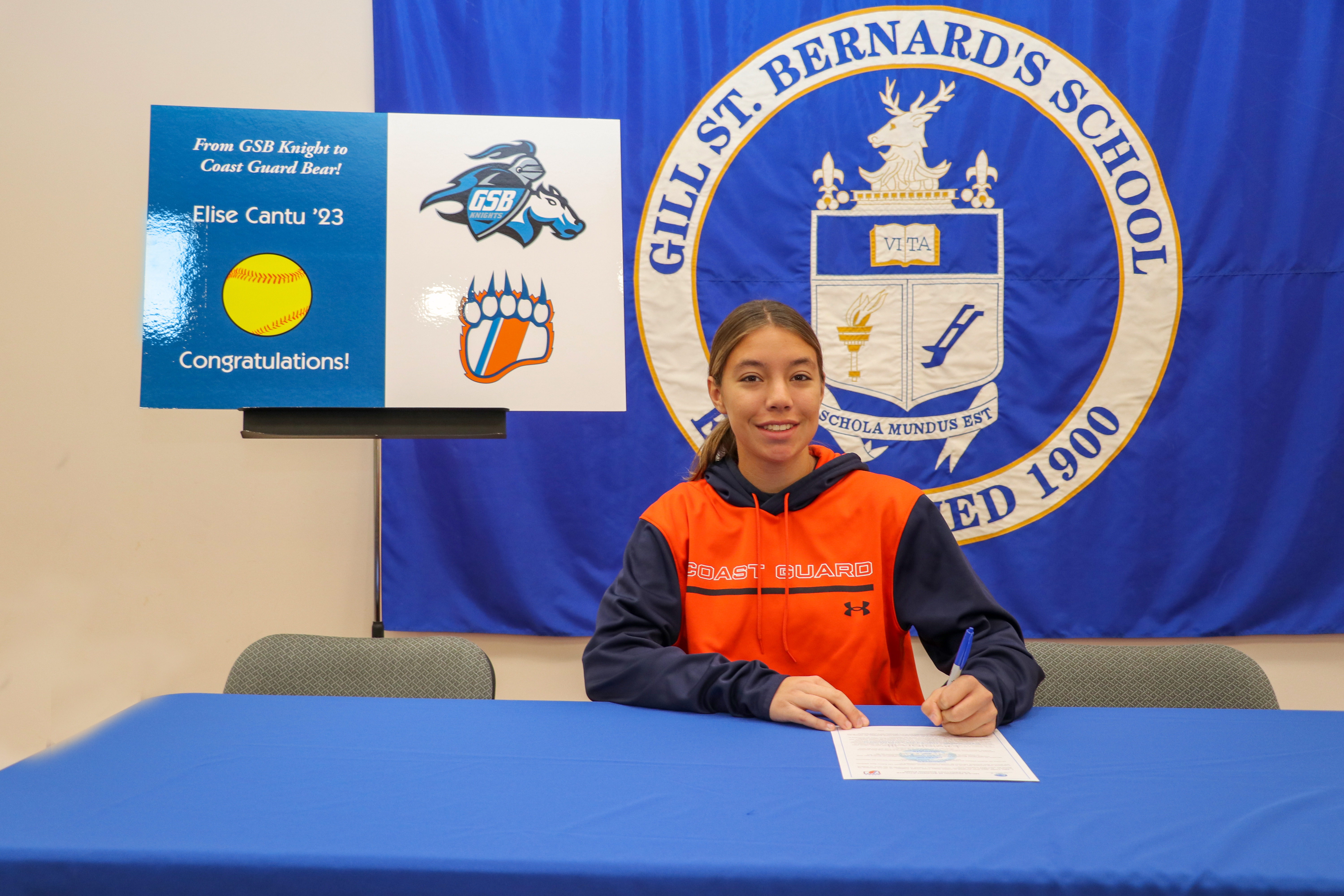 Elise Cantu of Gill St. Bernard's signs a commitment letter to play softball at the United States Coast Guard Academy.