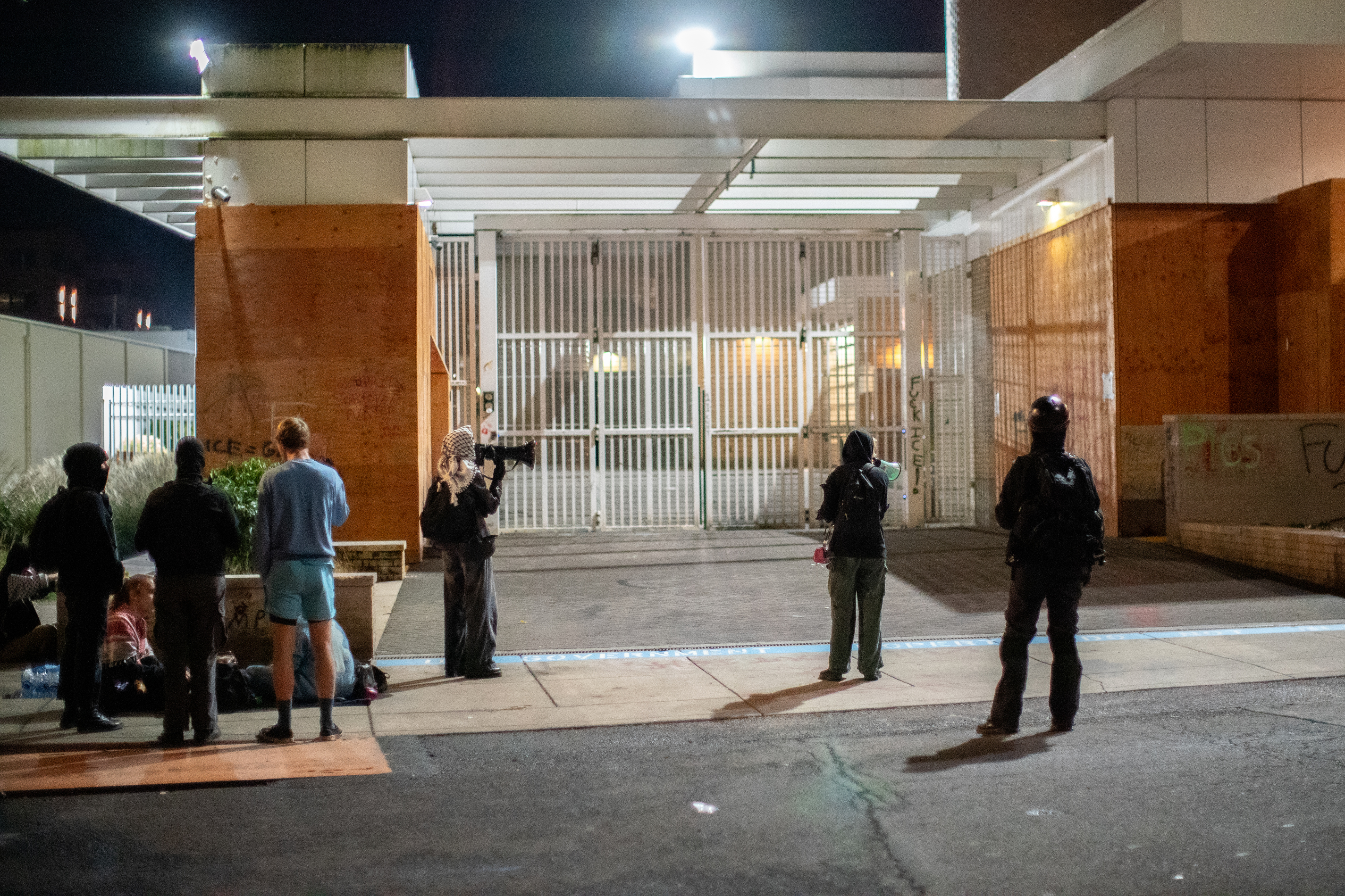Protesters gather outside the boarded-up U.S. Immigration and Customs Enforcement building in South Portland on Monday, Sept. 8, 2025, days after President Donald Trump suggested federal intervention.