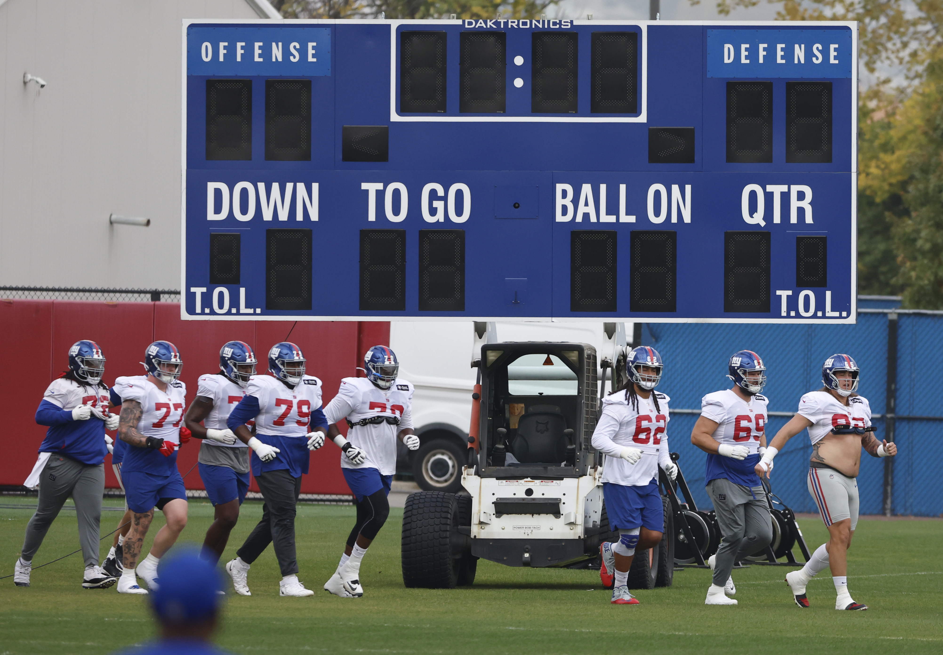 New York Giants center Nick Gates (65, right) leads the offensive linemen to the field during practice on Wednesday, Oct. 26, 2022. 