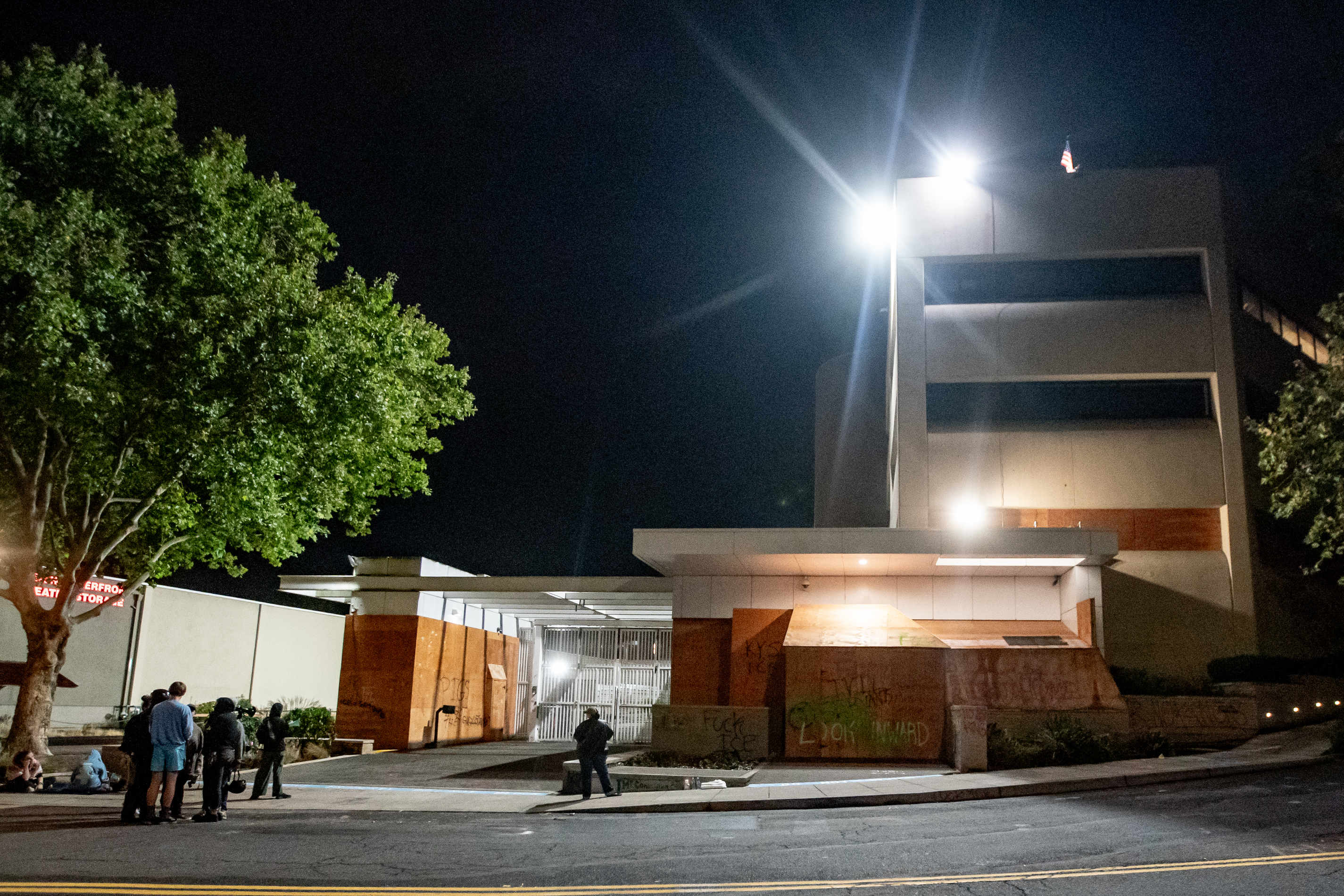 Protesters gather outside the boarded-up U.S. Immigration and Customs Enforcement building in South Portland on Monday, Sept. 8, 2025, days after President Donald Trump suggested federal intervention.