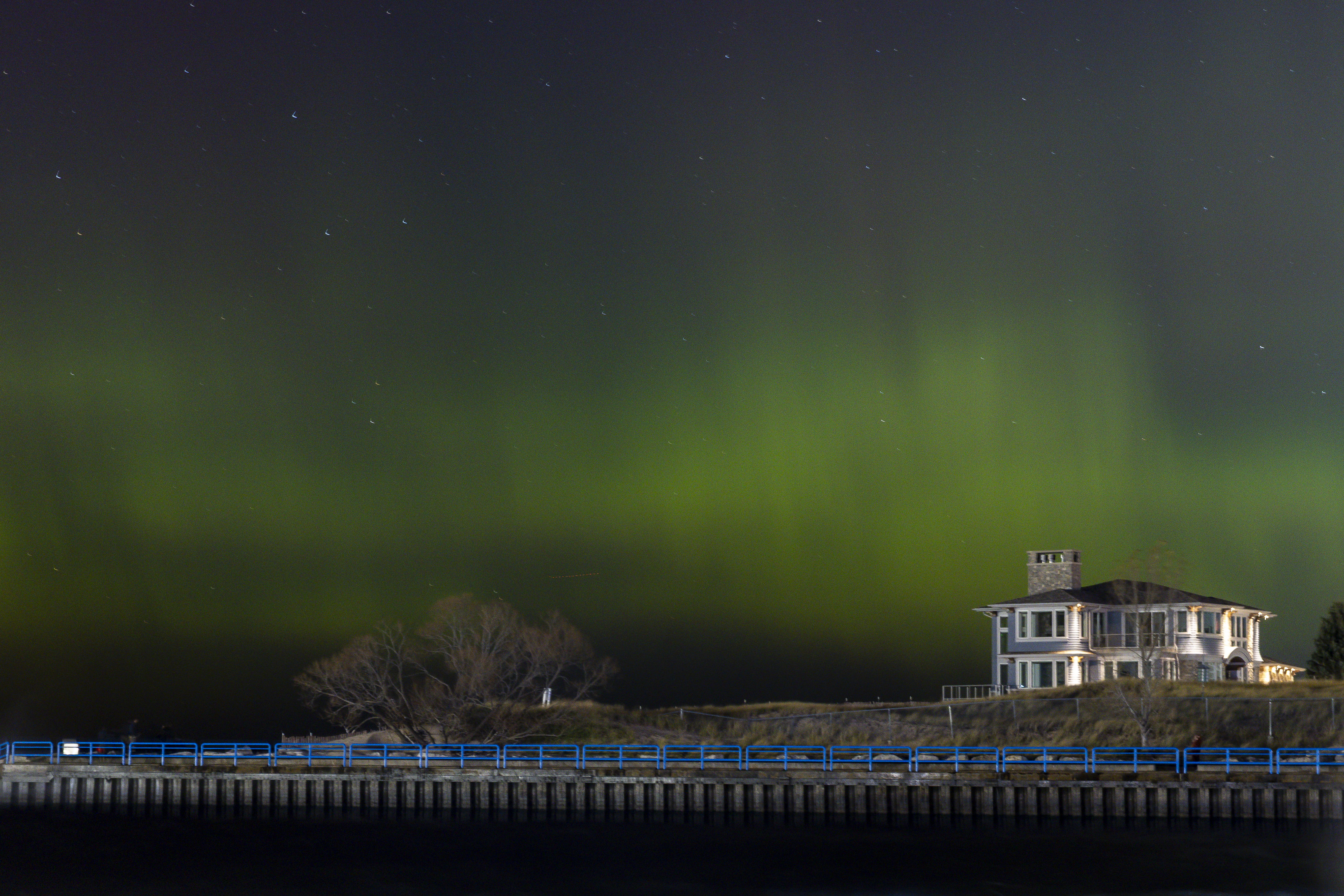 See photos as Northern Lights dance above iconic Lake Michigan