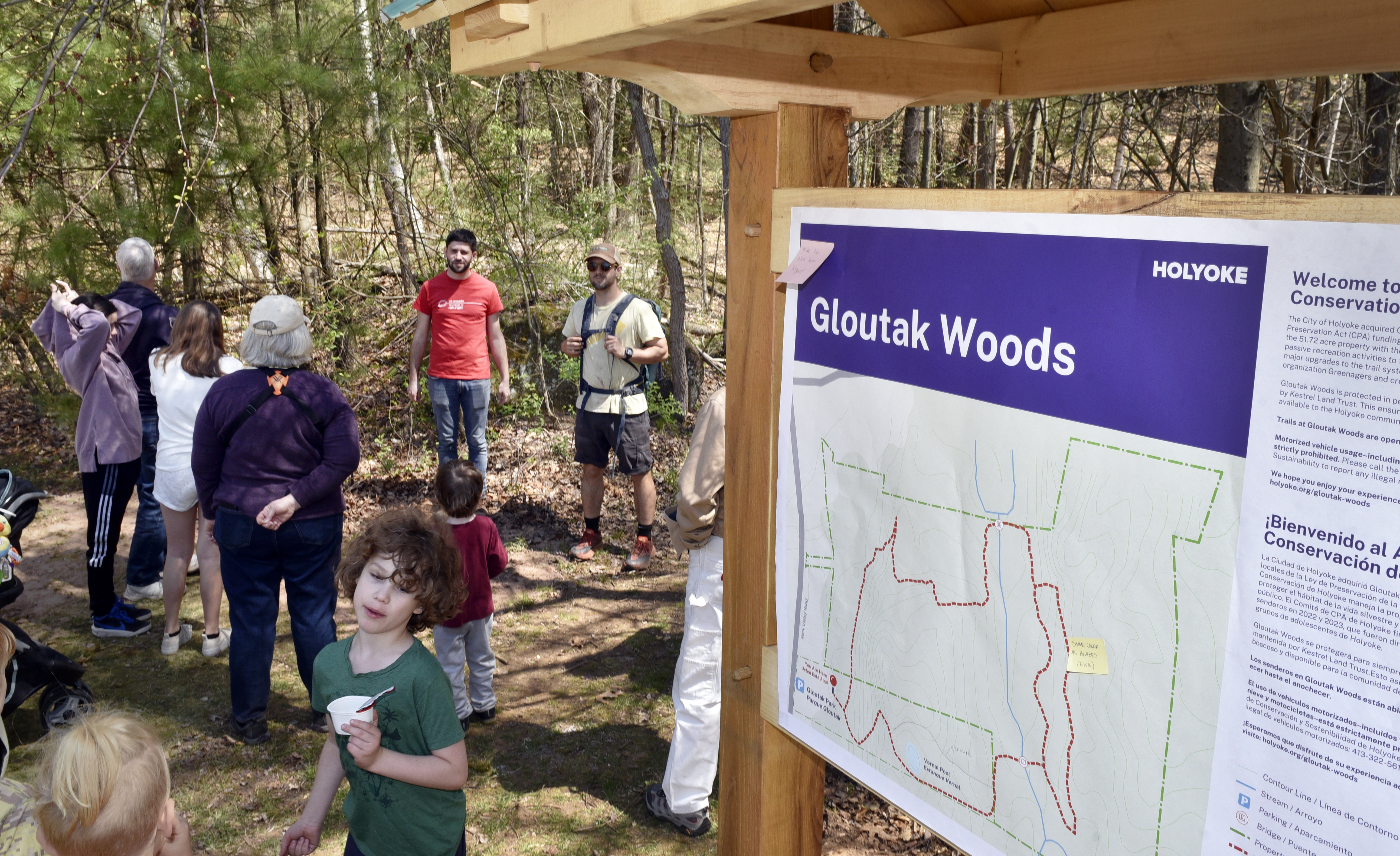 Yoni Glogower, Holyoke's Director of Conservation and Sustainability (orange shirt), gets ready to lead a hike along the recently renovated Gloutak Woods Trail.  (Don Treeger / The Republican)  4/21/2023
