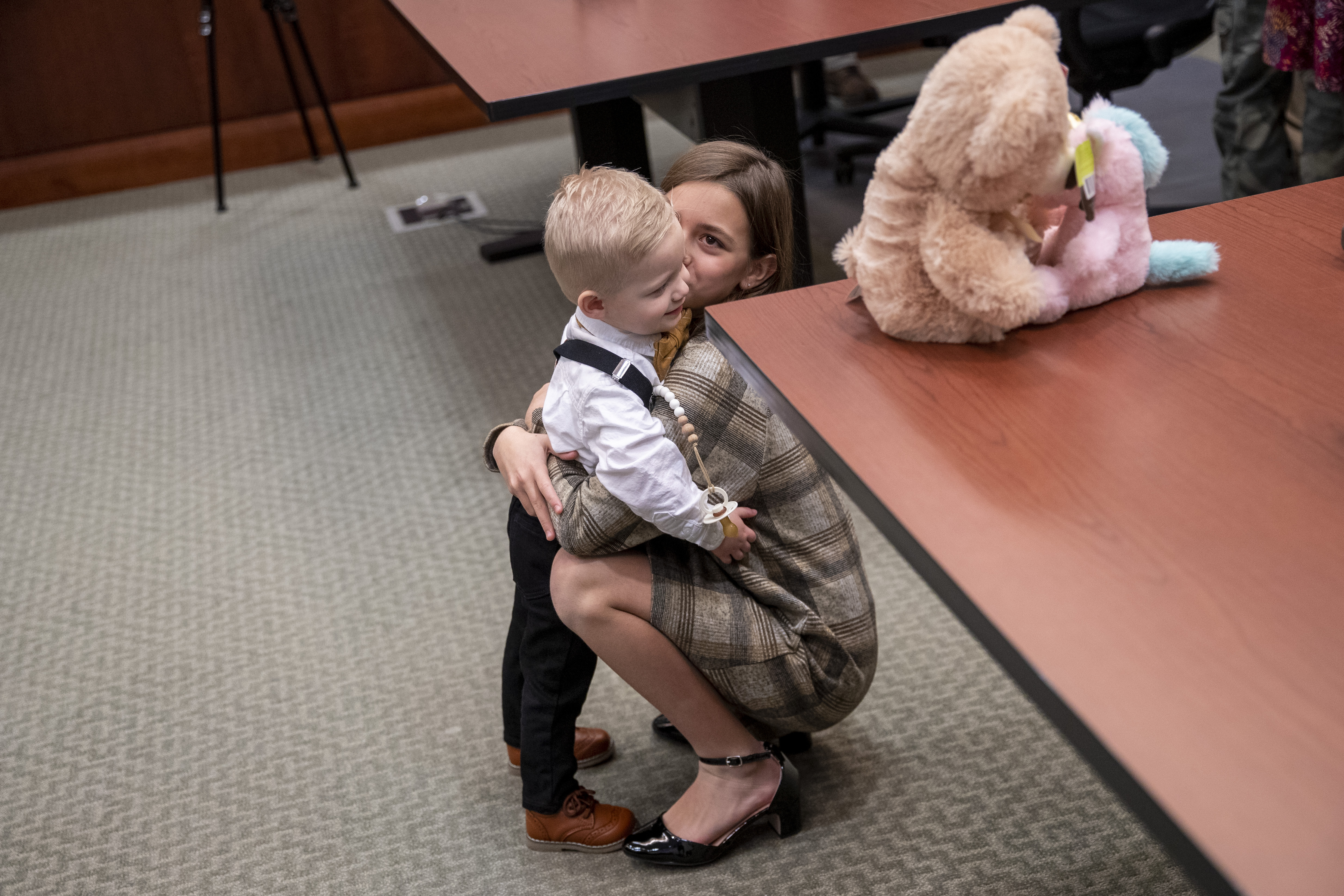 Corryn Myers, 10, hugs her brother Eames, 1, during Adoption Day at the Kent County Courthouse in Grand Rapids on Thursday, Dec. 8, 2022. Tammy and Jordan Myers are the biological parents of 1-year-old twins Eames and Ellison. Lauren Vermilye, a surrogate, gave birth to the twins after Tammy went through breast cancer treatment and has no claim to the babies. The Myers family was able to adopt the twins after convincing the court system to grant them custody. (Cory Morse | MLive.com)
