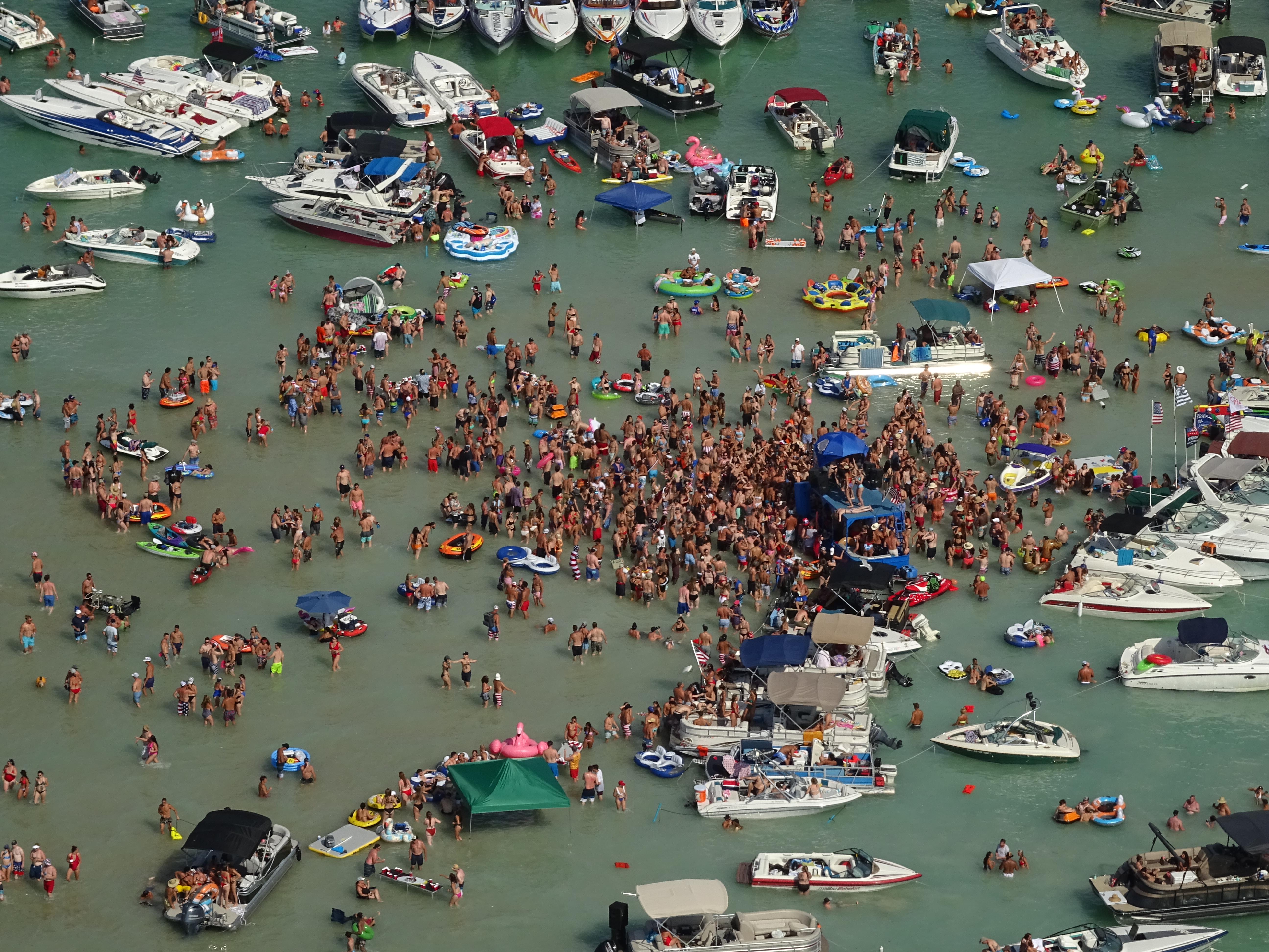 Several people at massive Torch Lake July 4 party have tested positive for ...