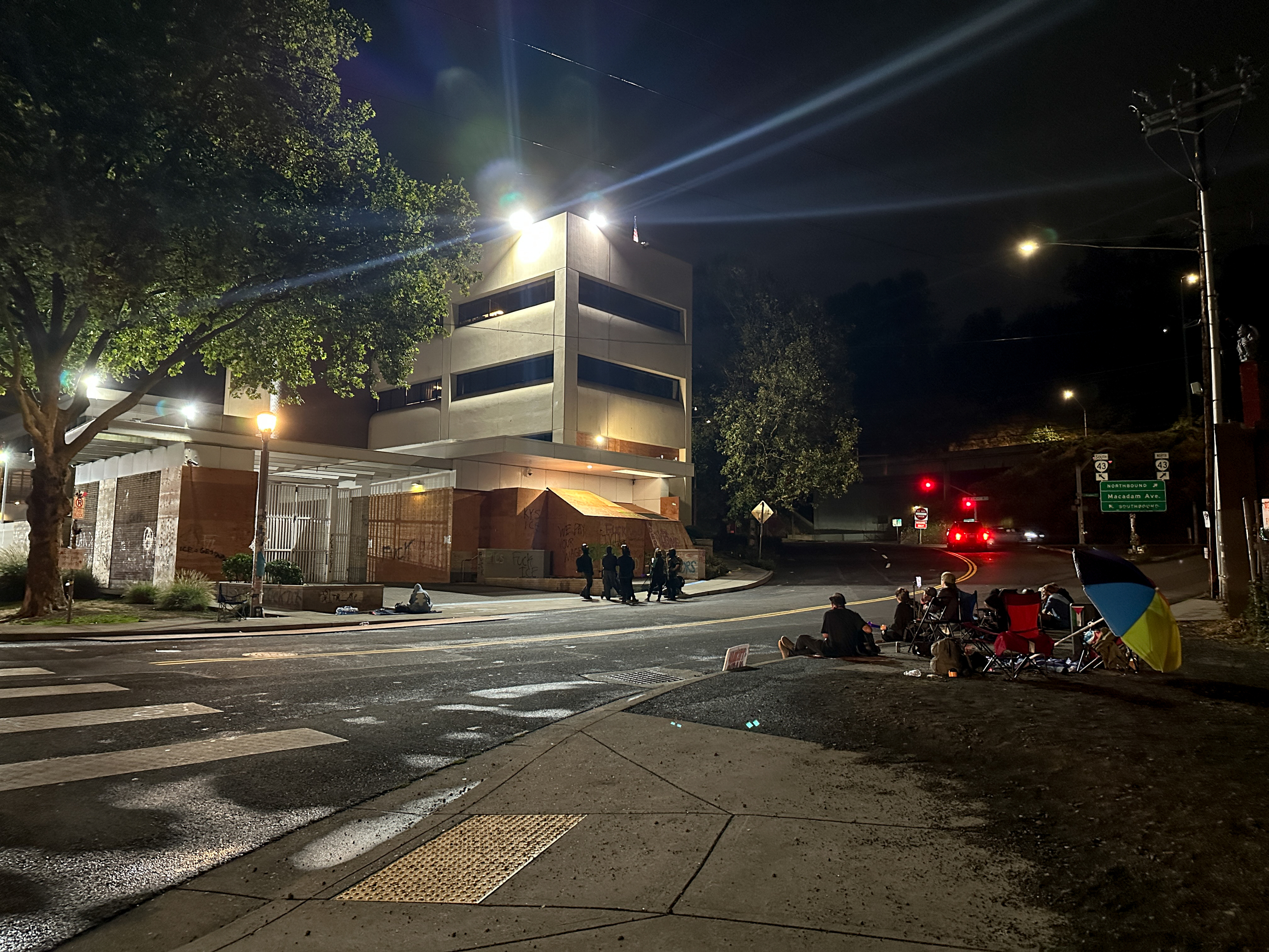 Protesters gather outside the boarded-up U.S. Immigration and Customs Enforcement building in South Portland on Monday, Sept. 8, 2025, days after President Donald Trump suggested federal intervention.
