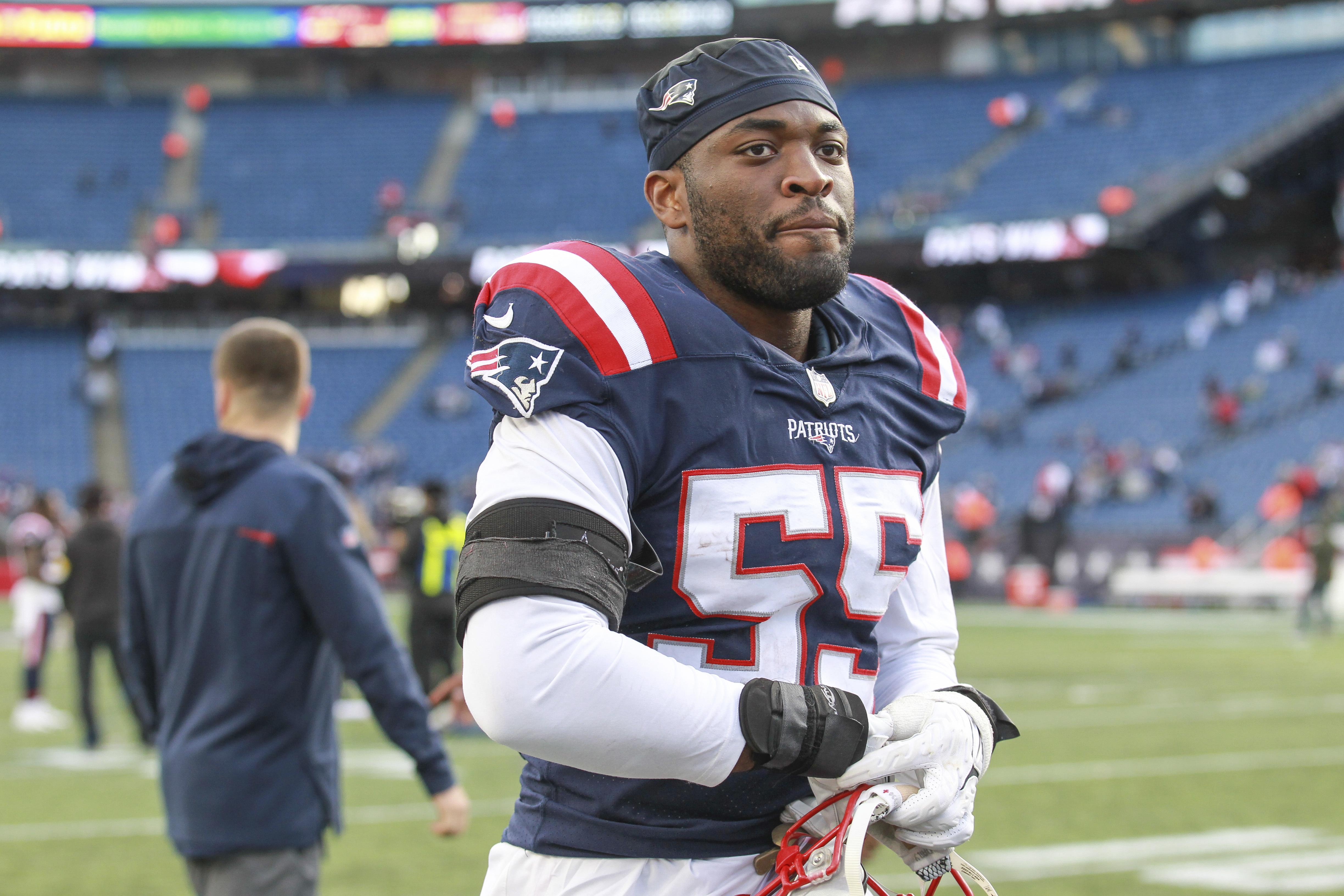 New England Patriots linebacker Josh Uche (55) lines up against the Arizona  Cardinals during the first half of an NFL football game, Monday, Dec. 12,  2022, in Glendale, Ariz. (AP Photo/Rick Scuteri