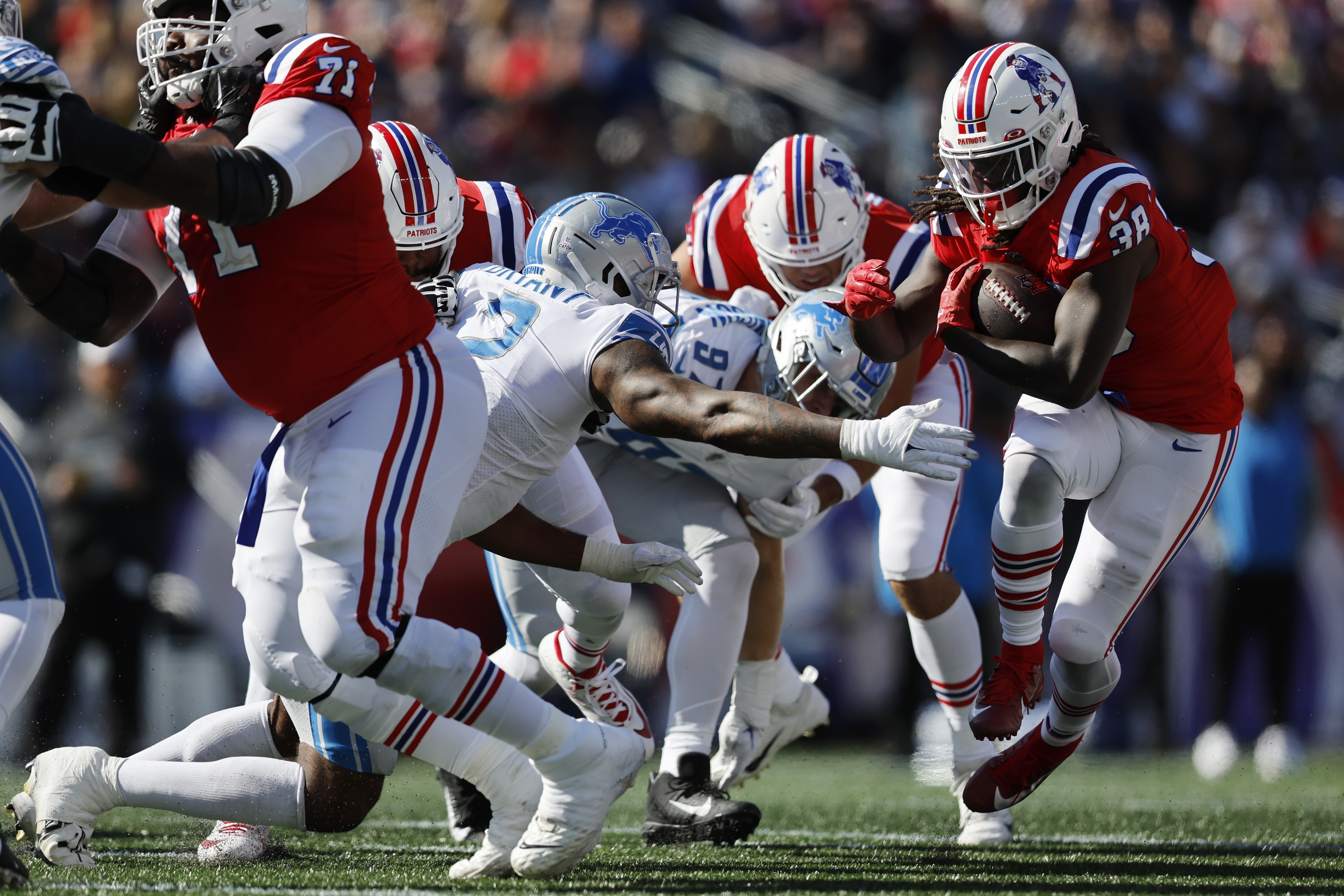 New England Patriots running back Rhamondre Stevenson (38) warms