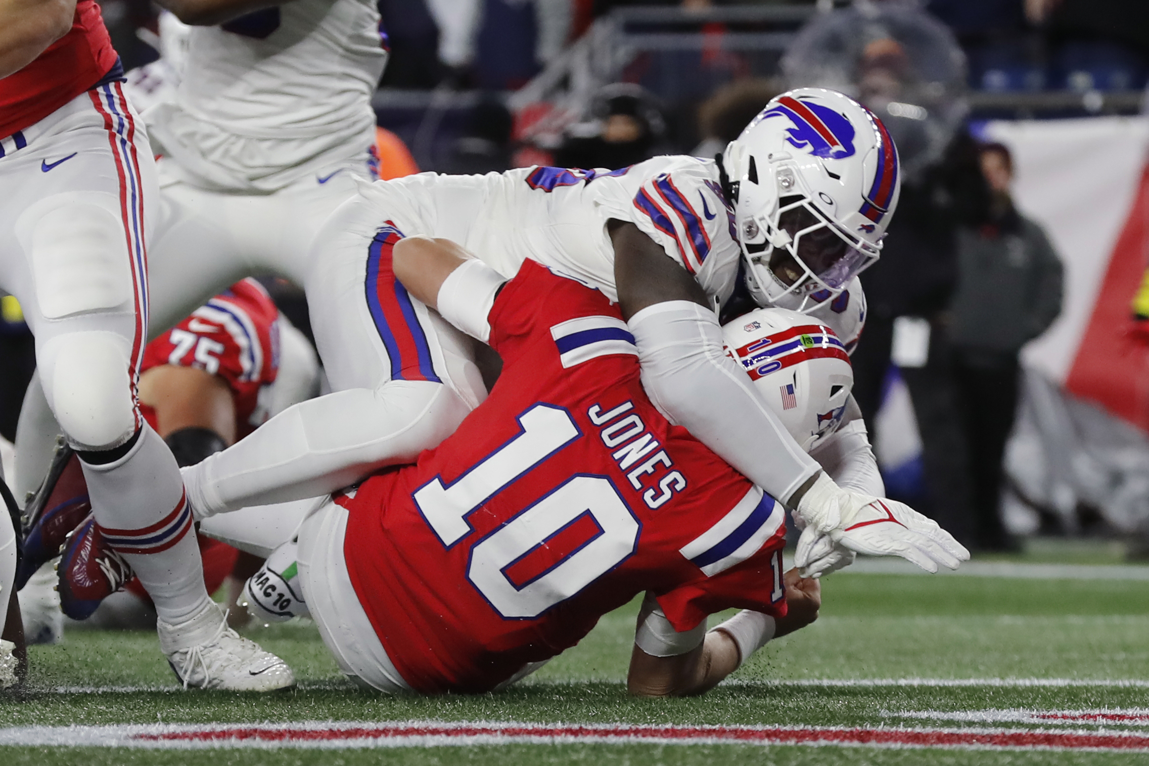 Patriots' QB Mac Jones suffers a left leg injury in week three