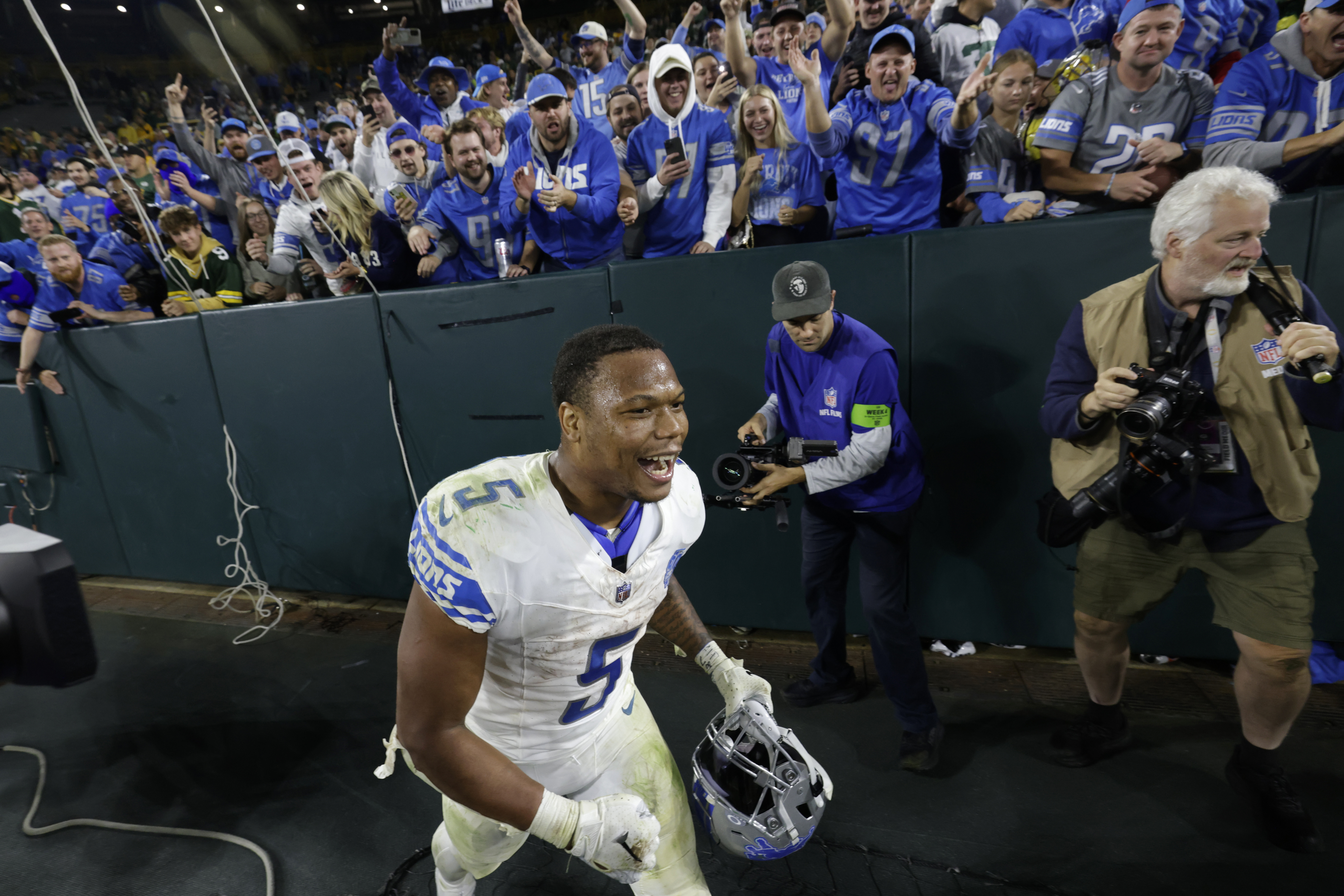 A Packers fan poured beer on Detroit Lions WR Amon-Ra St. Brown