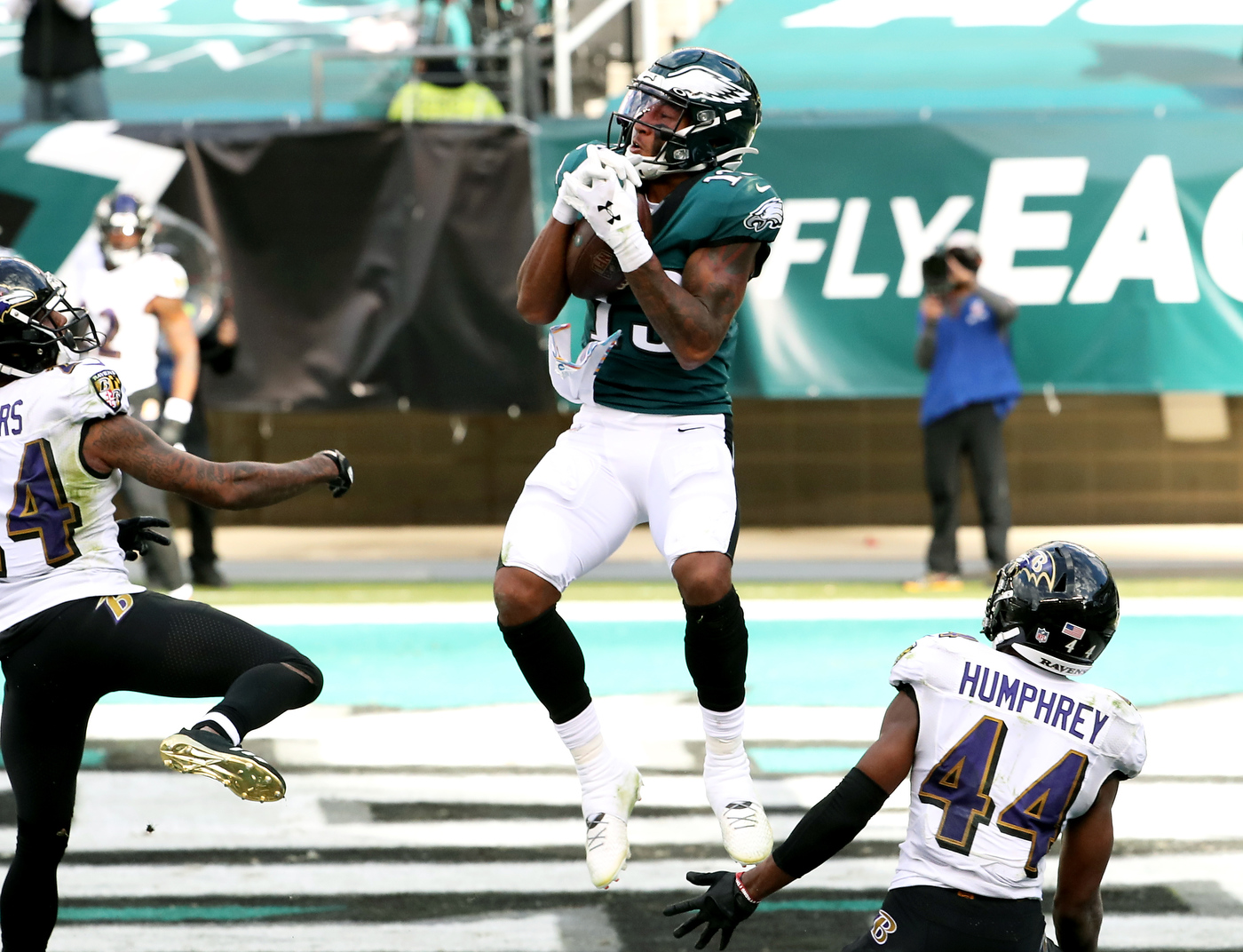 Philadelphia Eagles wide receiver John Hightower (82) runs onto