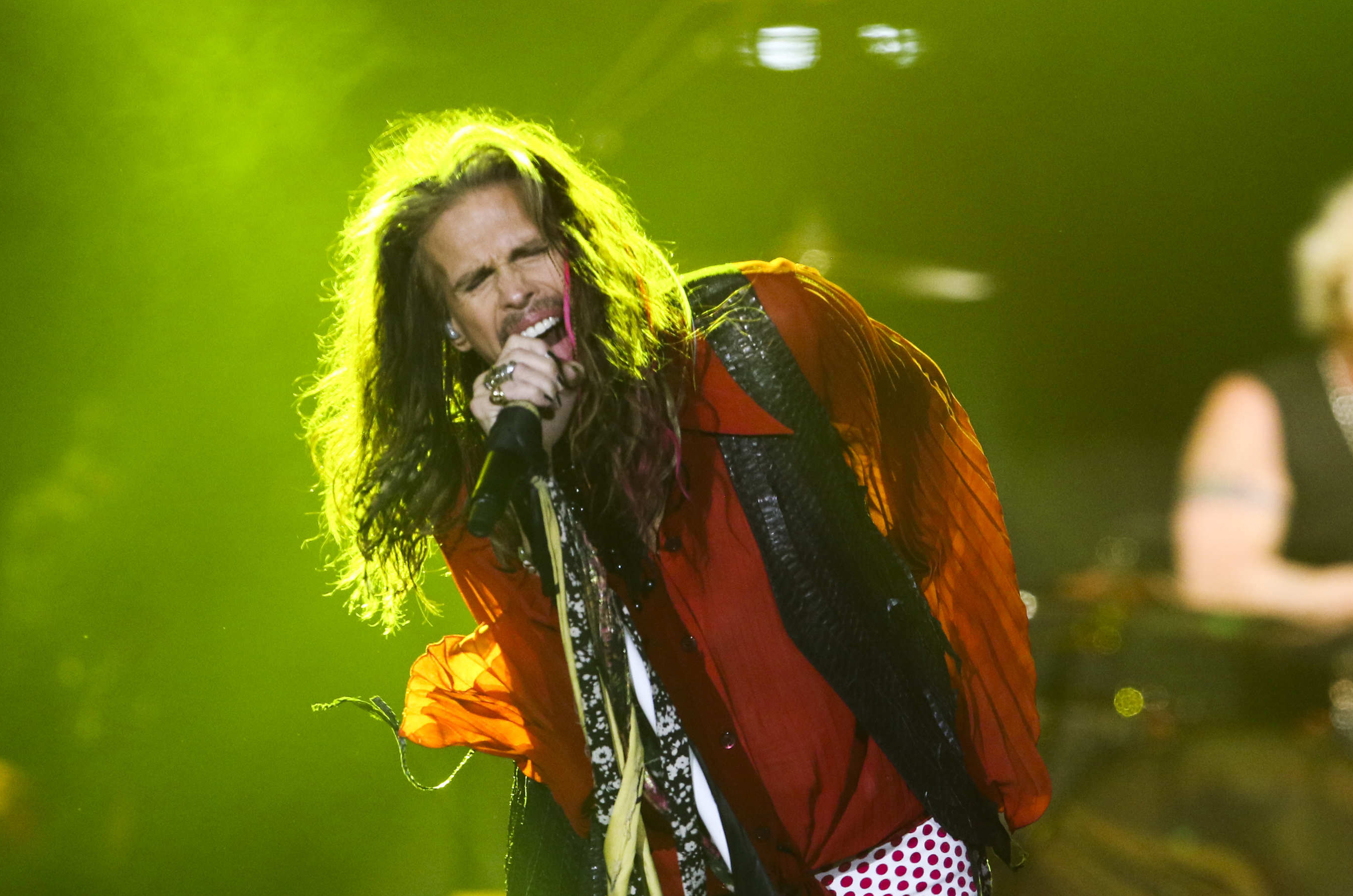 Aerosmith lead singer Steven Tyler sings 'God Bless America' during the  seventh inning stretch of the Red Sox home opener against the Detroit  Tigers at Fenway Park in Boston, Massachusetts on April