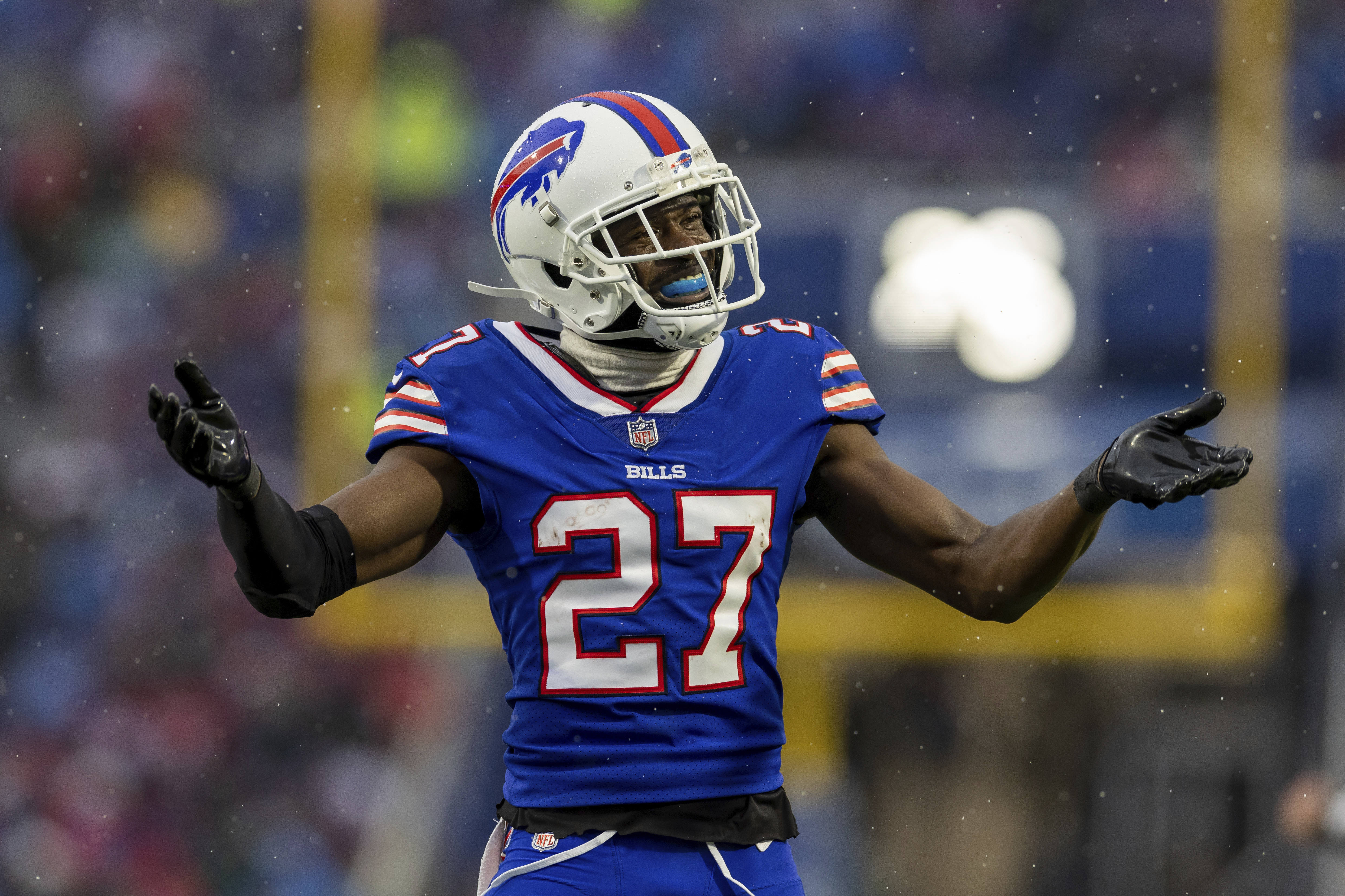 New York Jets running back Michael Carter (32) is brought down by Buffalo  Bills cornerback Taron Johnson (7) during the first half of an NFL football  game, Sunday, Dec. 11, 2022, in