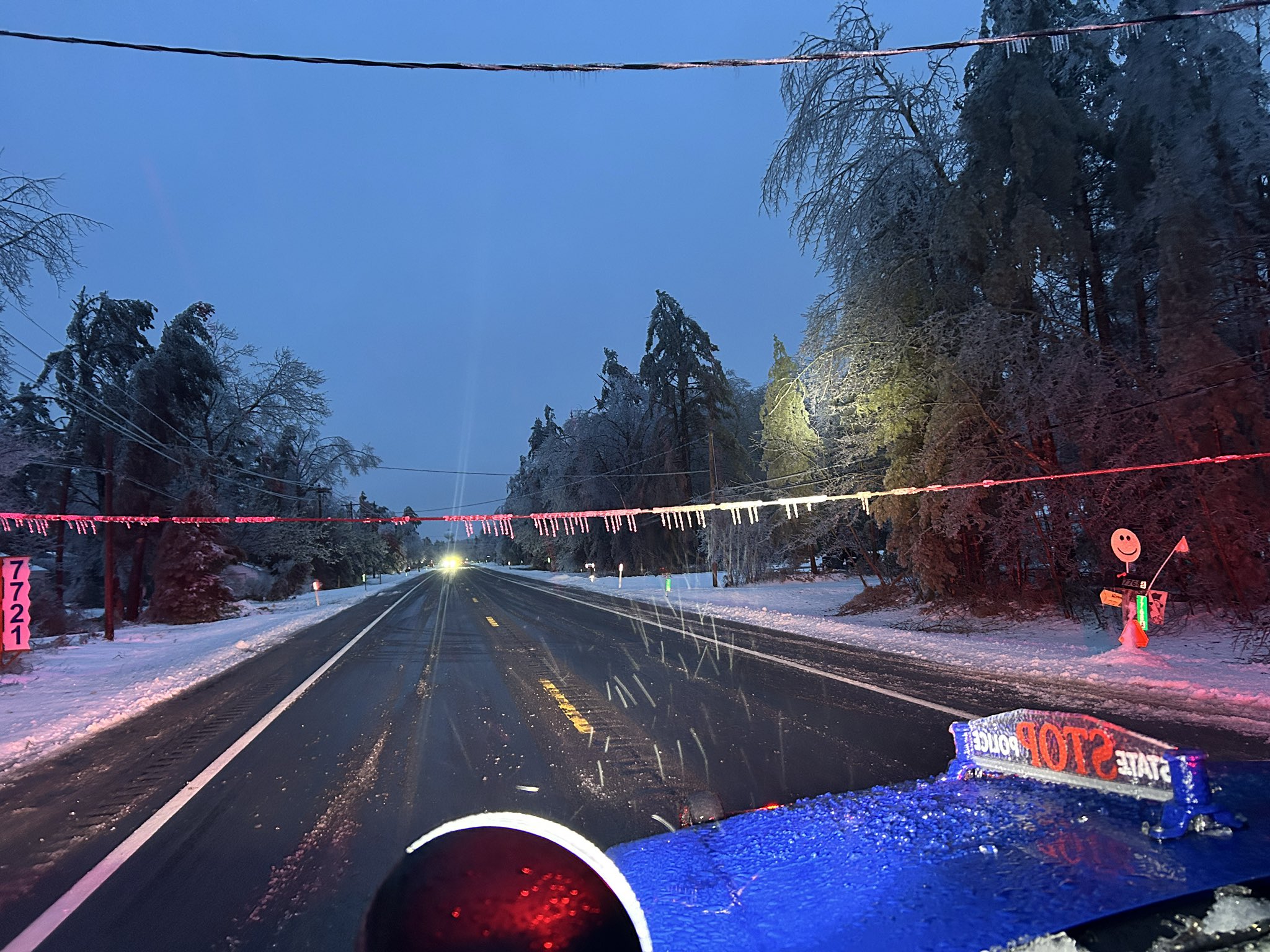 Trees, powerlines block roadways amid ice storm in Northern