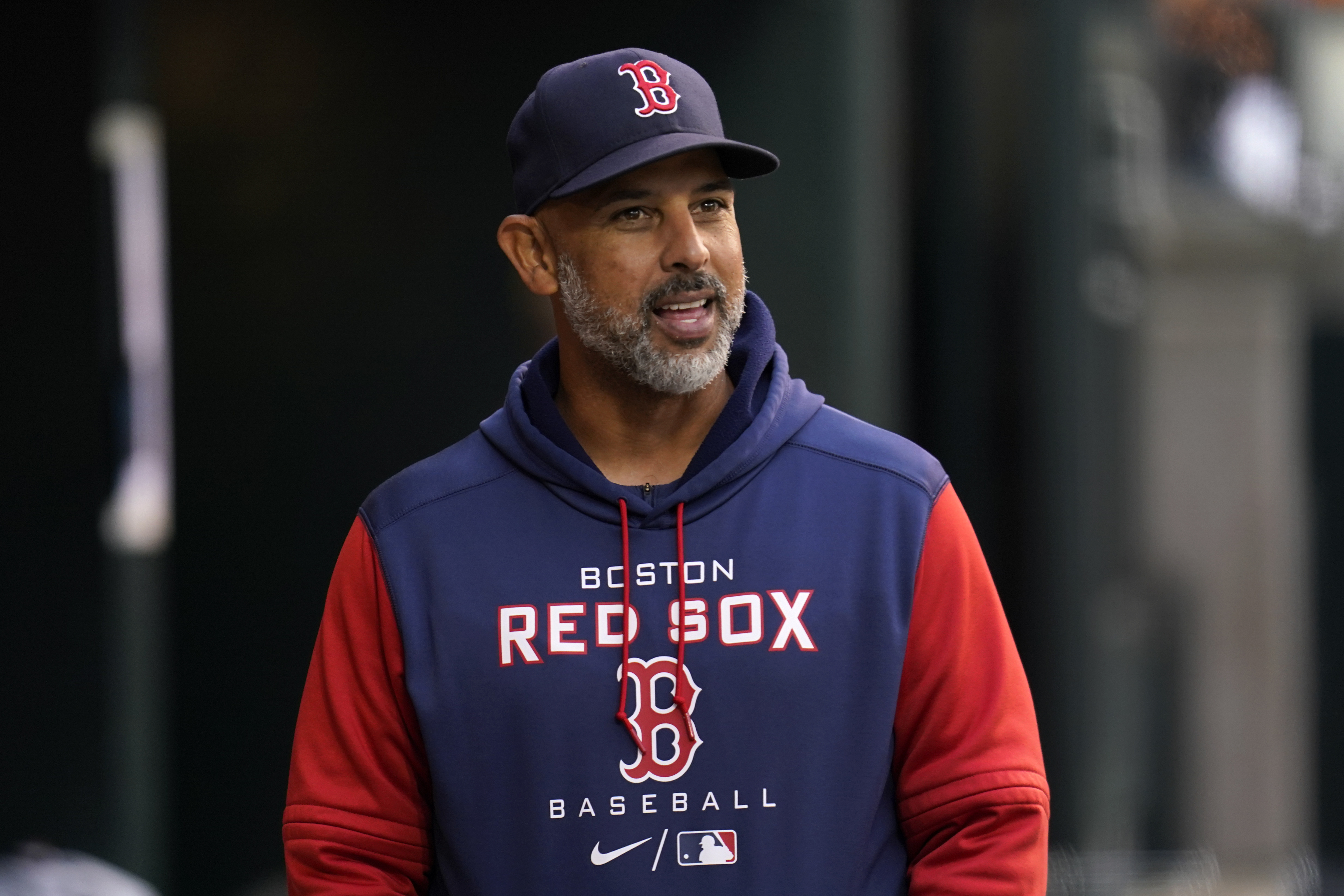 Boston Red Sox manager Alex Cora (20) talks with Minnesota Twins