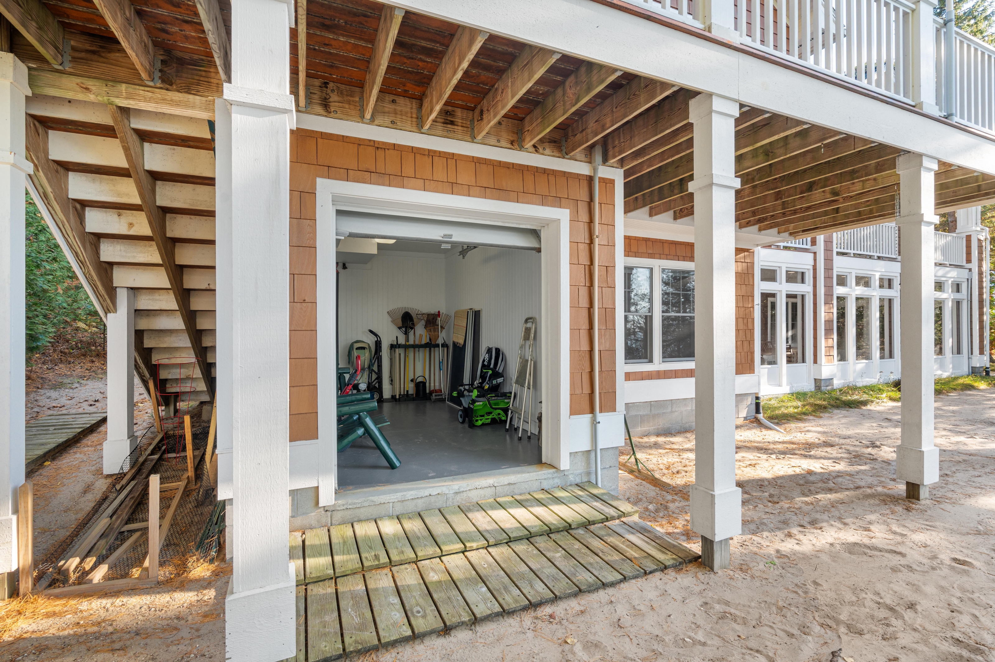 Exterior photographs of 4093 Lake Shore Drive in Charlevoix, this gem is listed at $2,099,900 through Berkshire Hathaway HomeServices Michigan Real Estate – Traverse City and The Crane Group with associate broker Johnny Crane and his brother, co-listing agent Matt Crane.