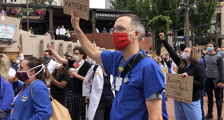 Healthcare workers rally in Pioneer Square to support demonstrations ...