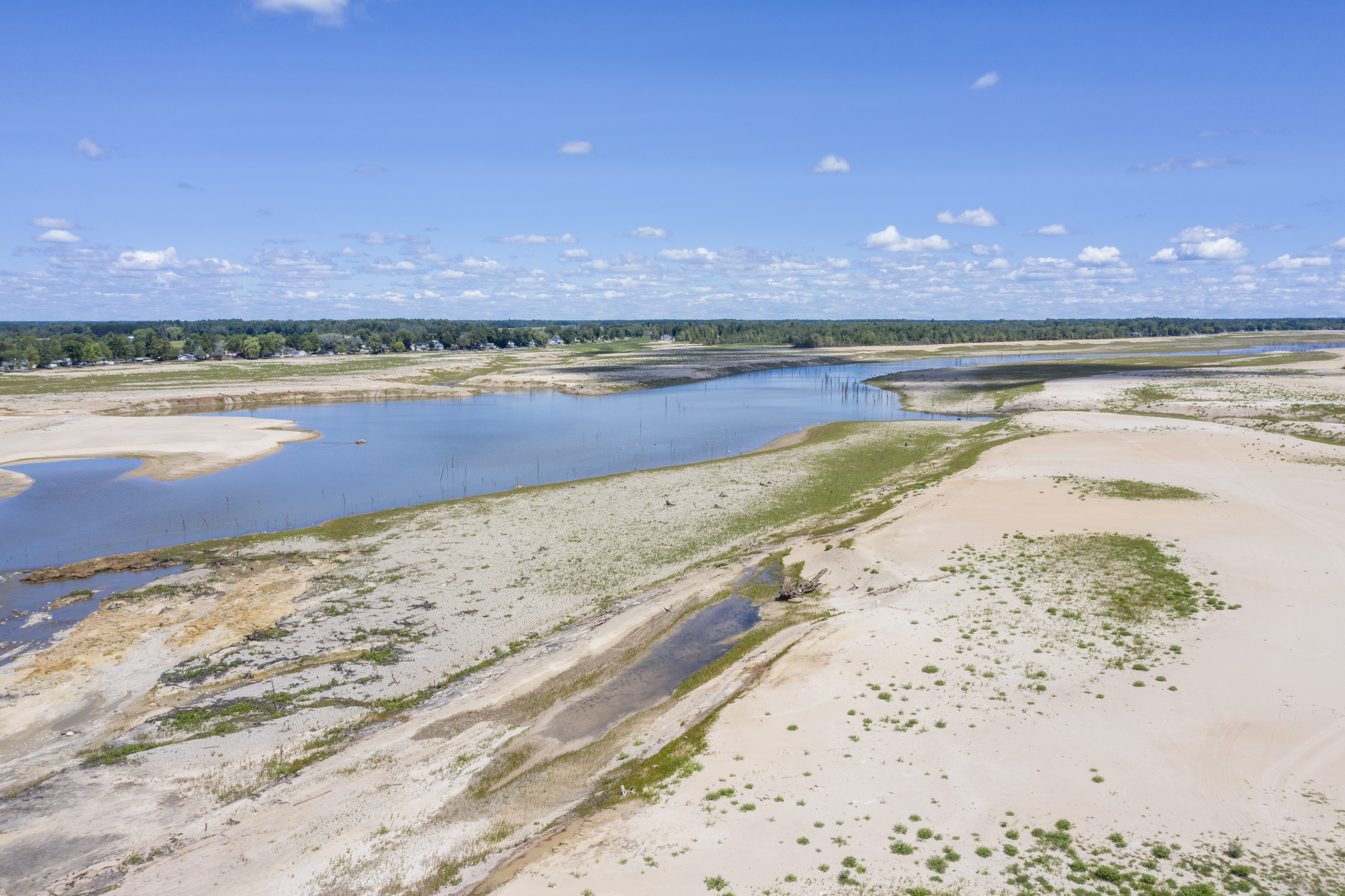 A view of what's left of Wixom Lake in Hope Township on Thursday, July 30, 2020. The devastating flood in May due to the failure of the Edenville and Sanford Dam left Wixom and Sanford Lake nearly empty. (Kaytie Boomer | MLive.com)