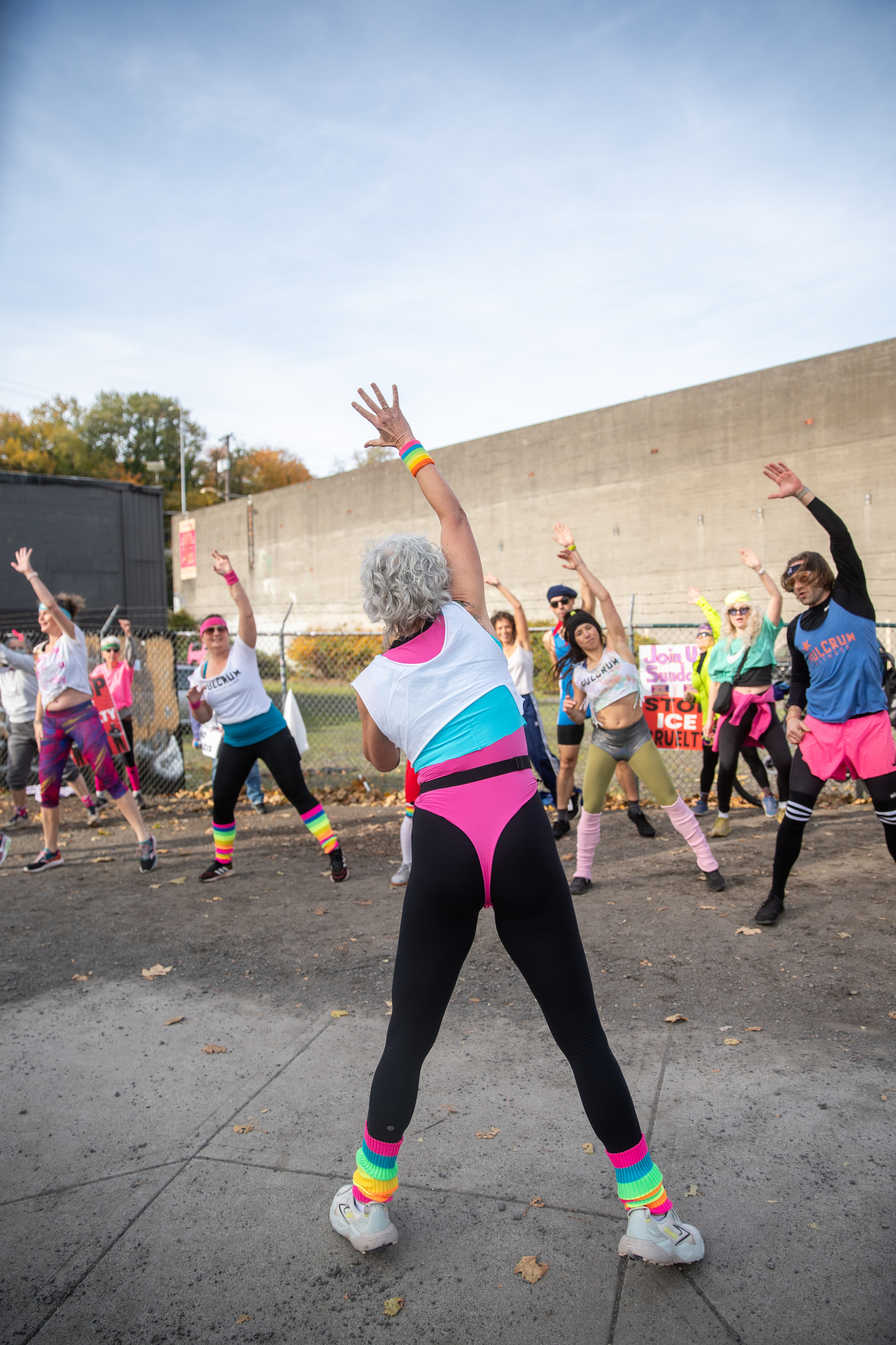 Participants in Fulcrum Fitness’s “Sweatin’ Out the Fascists” held an ’80s-aerobics peaceful protest outside the U.S. Immigration and Customs Enforcement (ICE) facility in South Portland on Sunday, Nov. 9, 2025, collecting donations for the Oregon Food Bank.