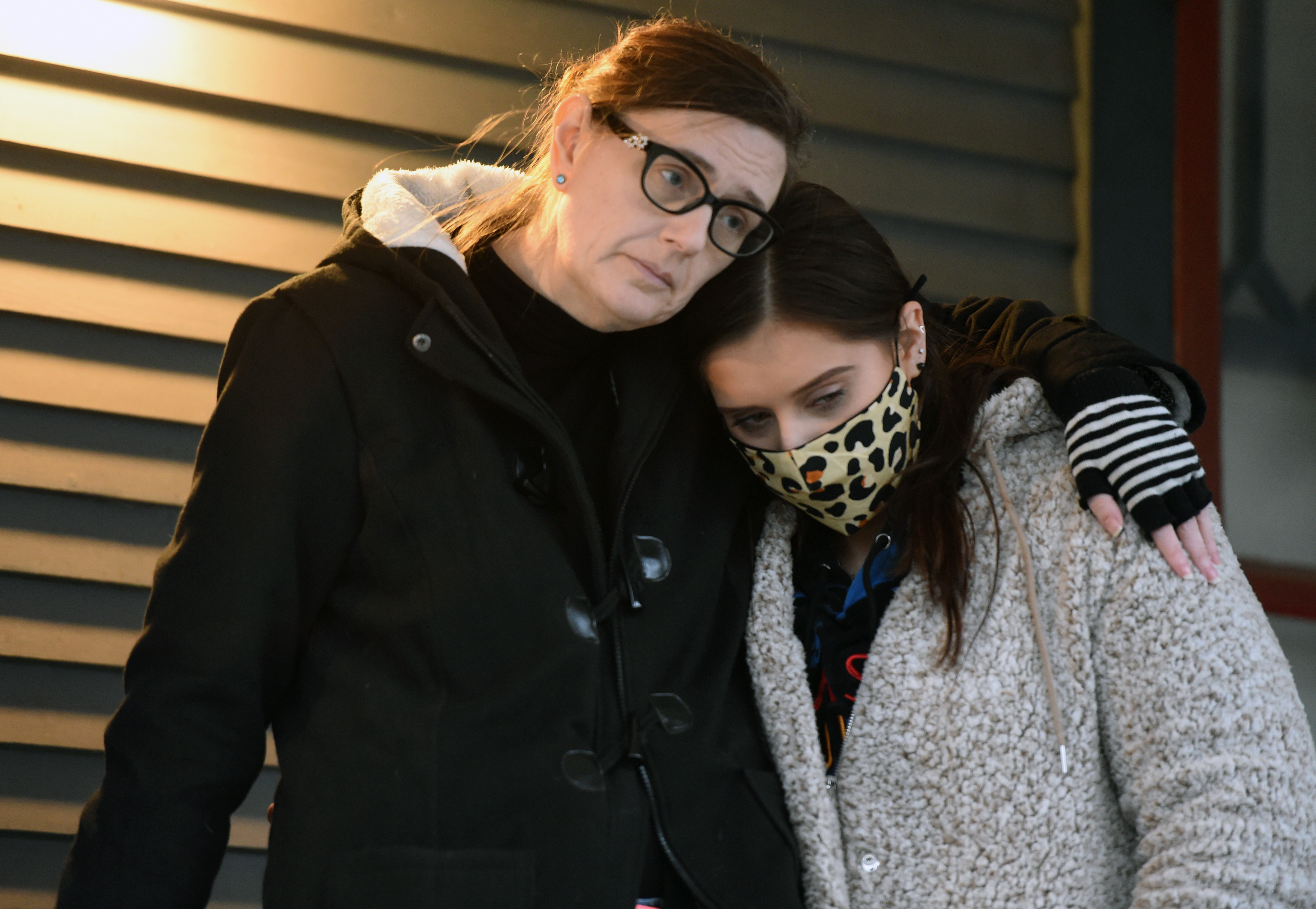 Bessis Ragan, mother, embraces the late Jerry Murray's girlfriend Sydney Talarico. Jerry was murdered Wednesday November 9th, Trinity Place, Syracuse, N.Y., Saturday, November 21, 2020.
