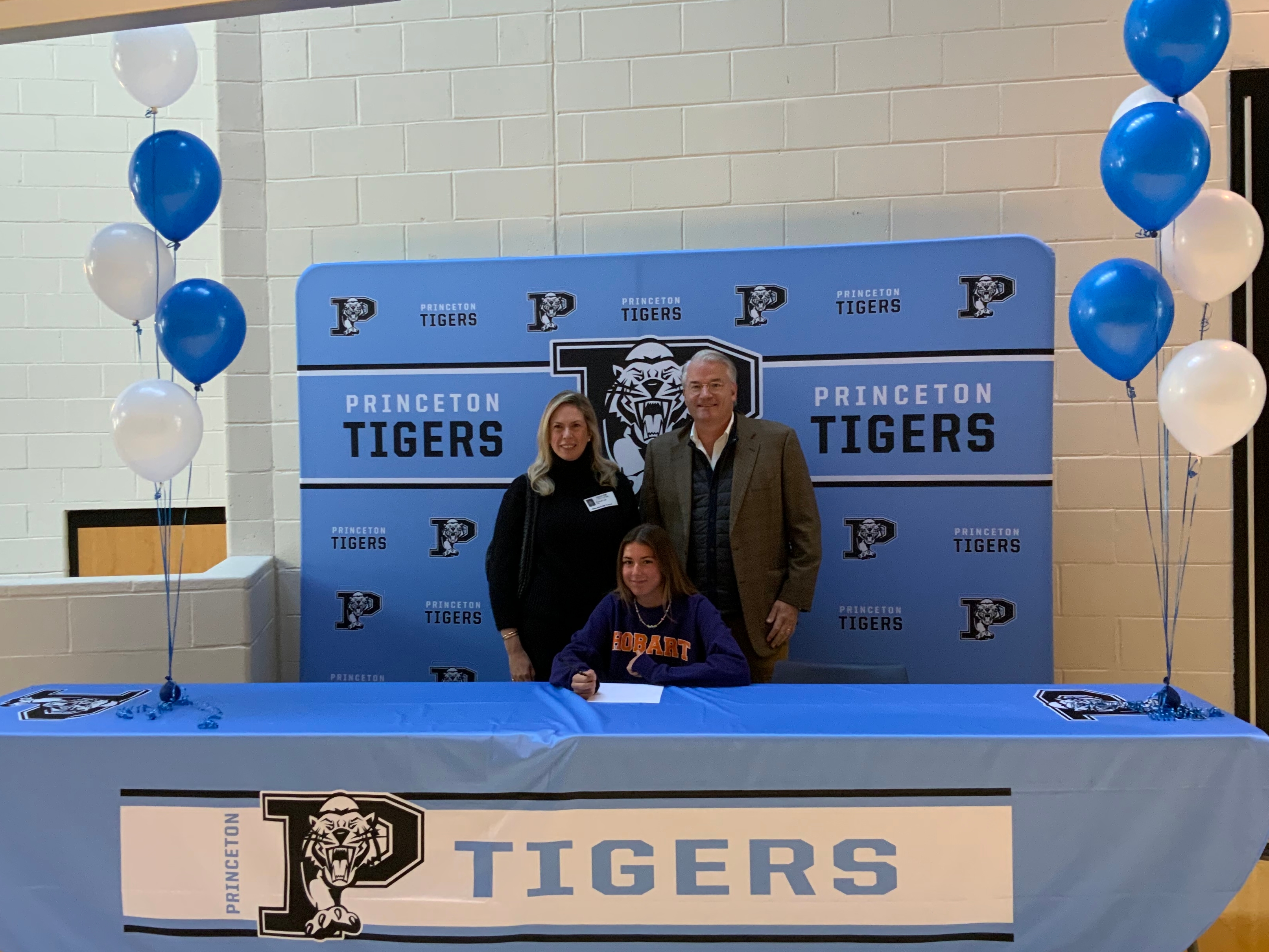 Princeton High School Student Athlete Olivia Helms will be attending Hobart and William Smith College for Woman’s Rowing. In this photo Olivia is accompanied by her mother and step father Rachel and Justin Lee.