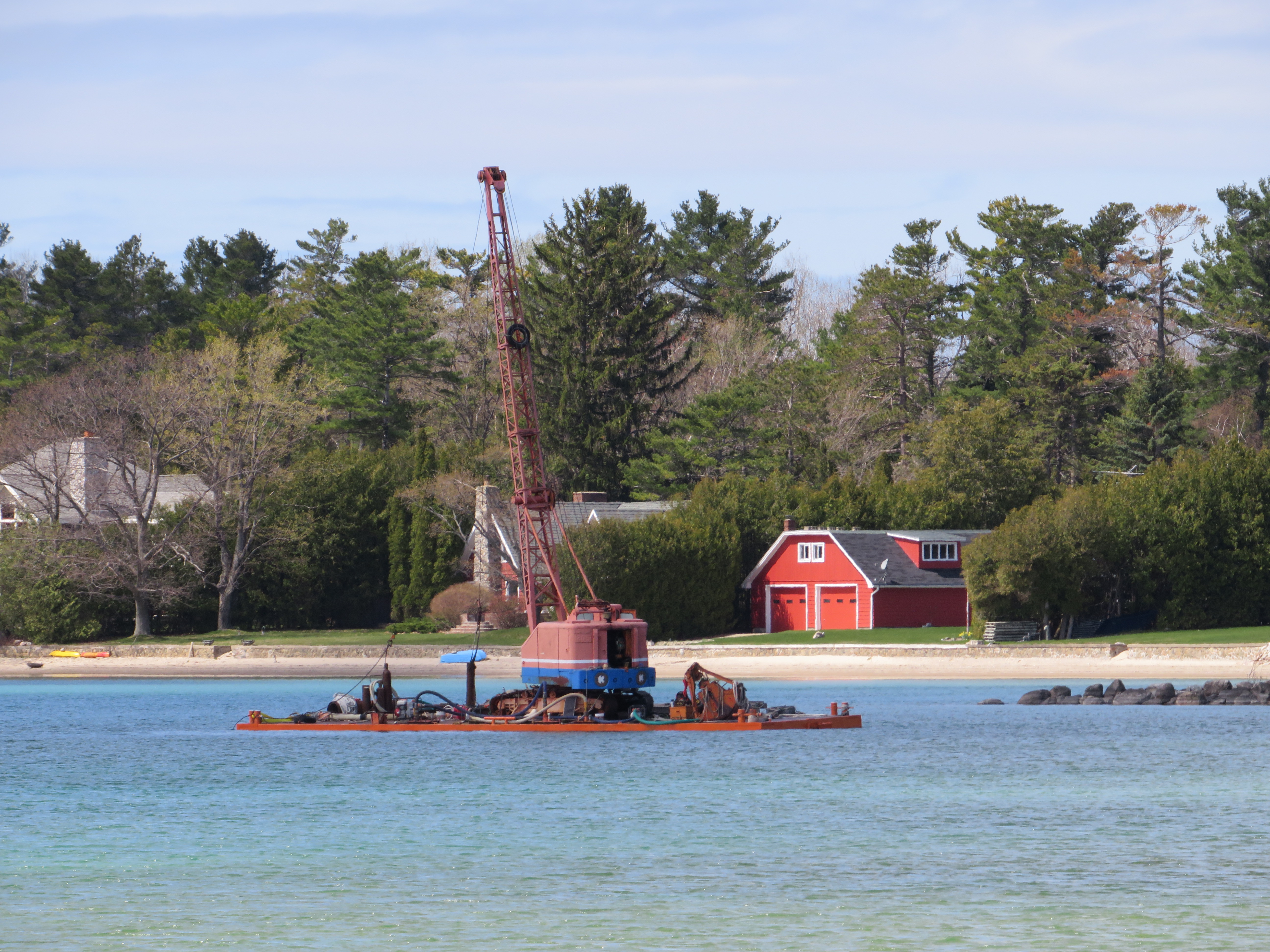 A barge owned by Balcom Marine Contracting is floating again after sinking for a second time in Grand Traverse Bay.
