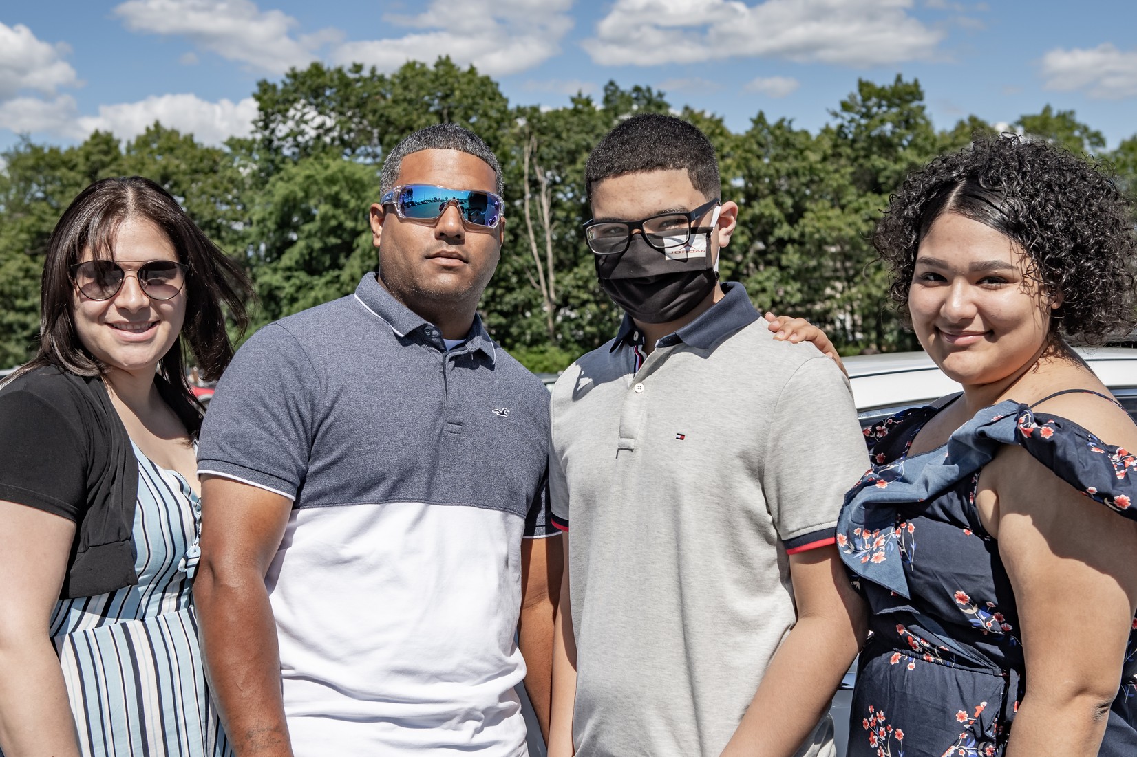Eli Figueroa Jr. and family pose for a photo at the Veritas Prep Charter School 8th grade 2020 DRIVE-In Graduation held in the parking lot of the Eastfield Mall. (Danny Nason Photo)