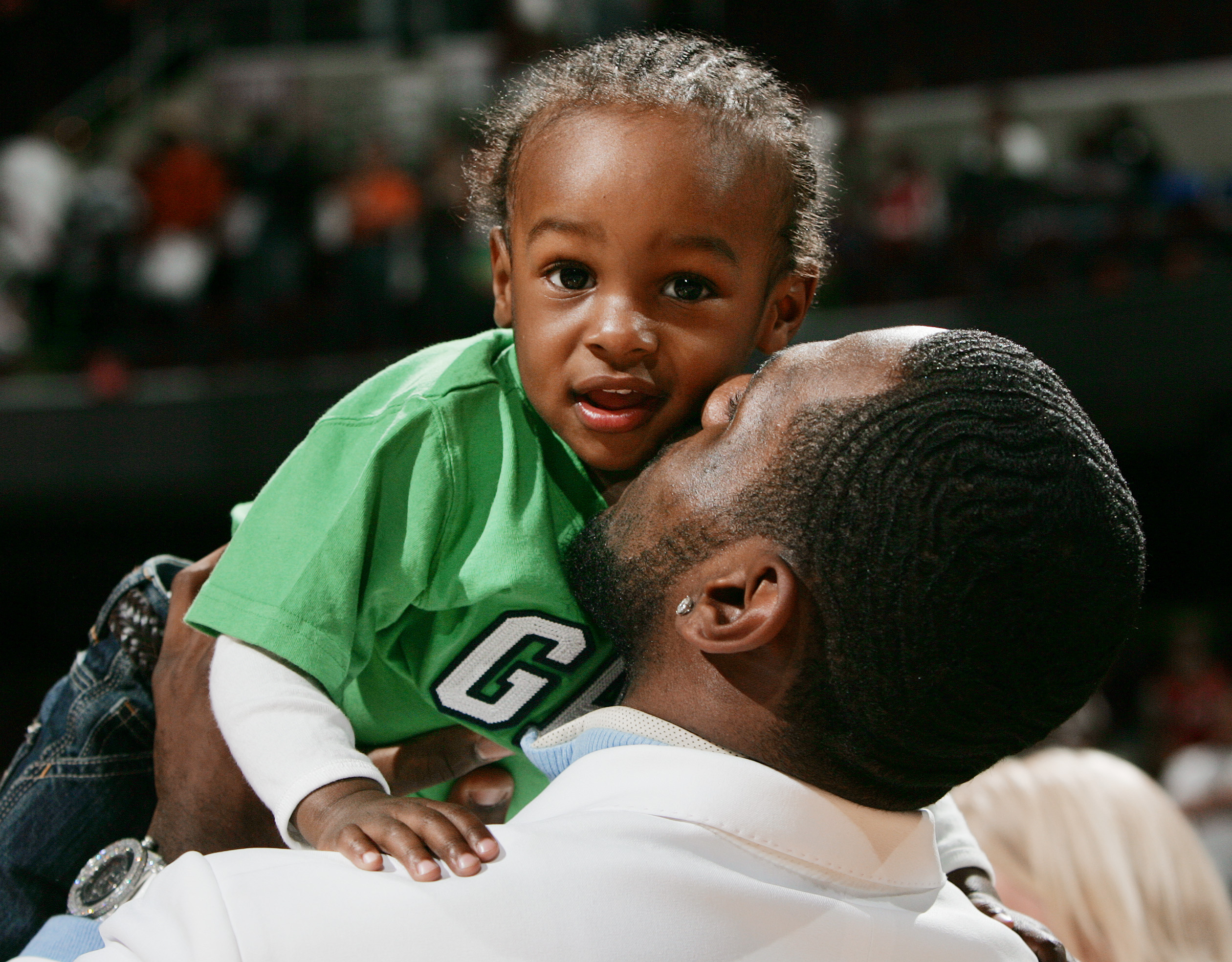 Cleveland Cavaliers LeBron James gives a kiss to his son LeBron James Jr. after their victory against the Atlanta Hawks April 19, 2006 at Quicken Loans Arena in Cleveland.  (John Kuntz/The Plain Dealer)